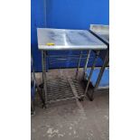 Stainless steel mobile unit with stainless steel work surface at the top below which is a pull-out w