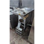 Commercial mincer on dedicated stand with assorted ancillaries