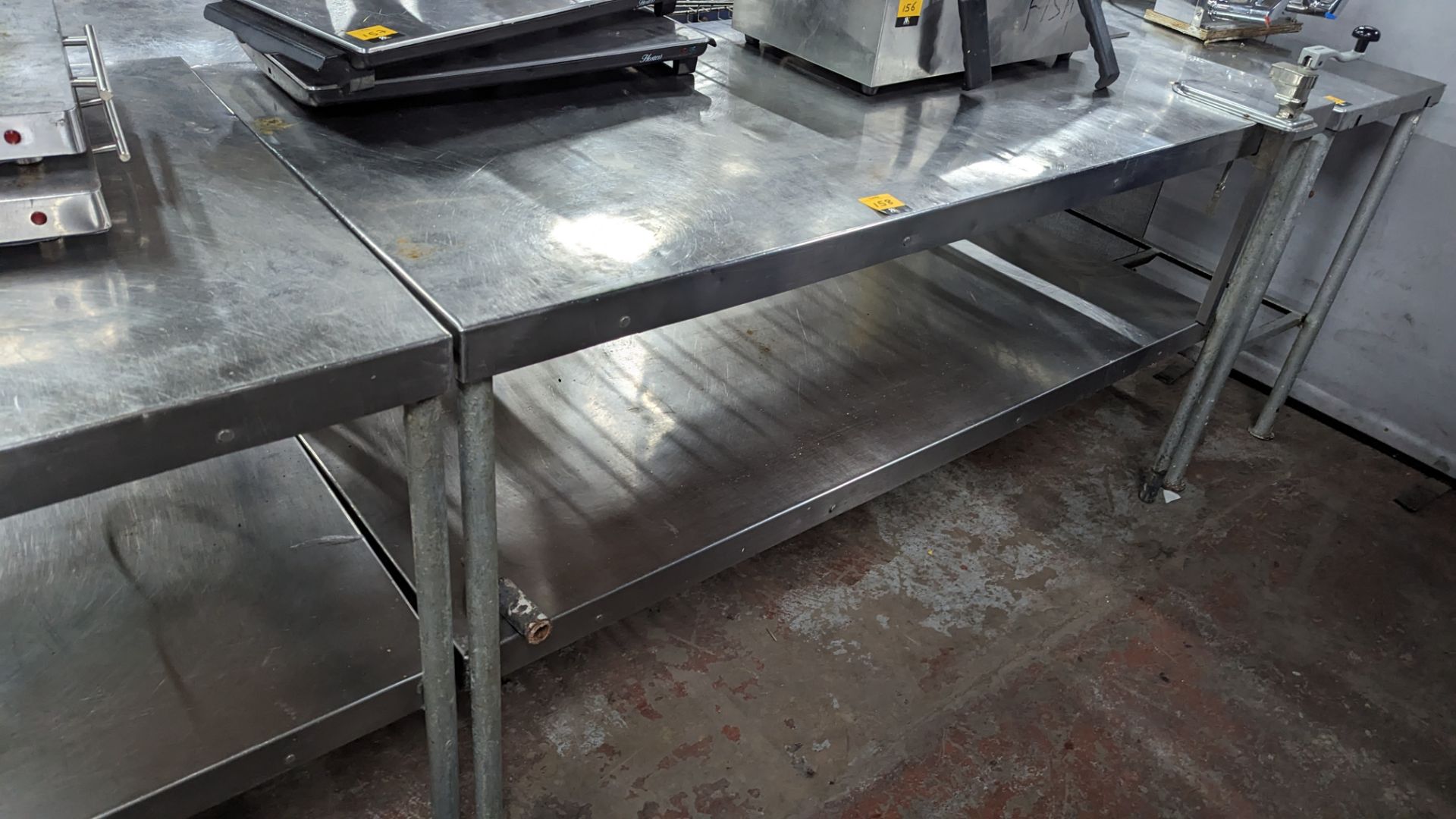 Stainless steel twin tier table including Vogue commercial can opener attached to same. NB max exte