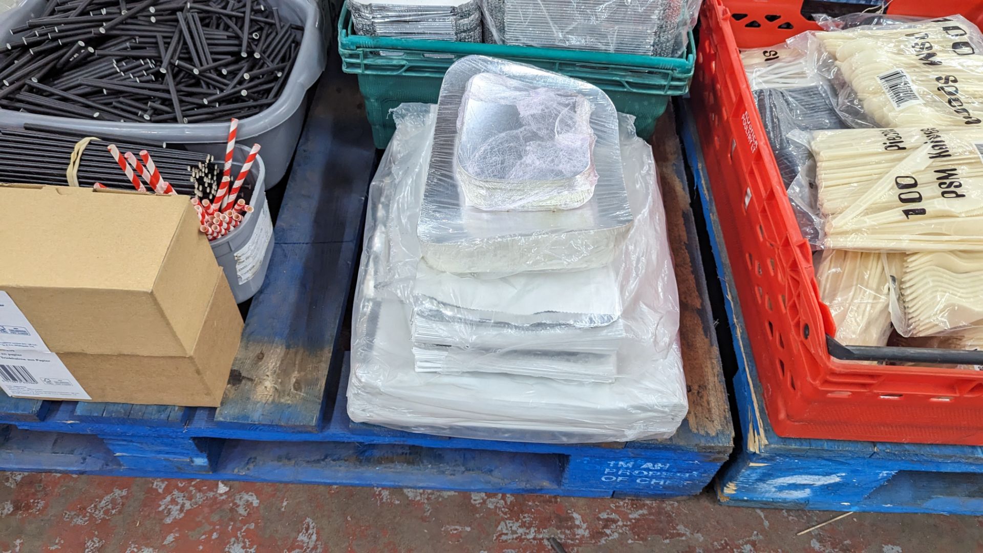The contents of a pallet of disposable items including foil trays & lids, straws, plates & more. NB - Image 3 of 12