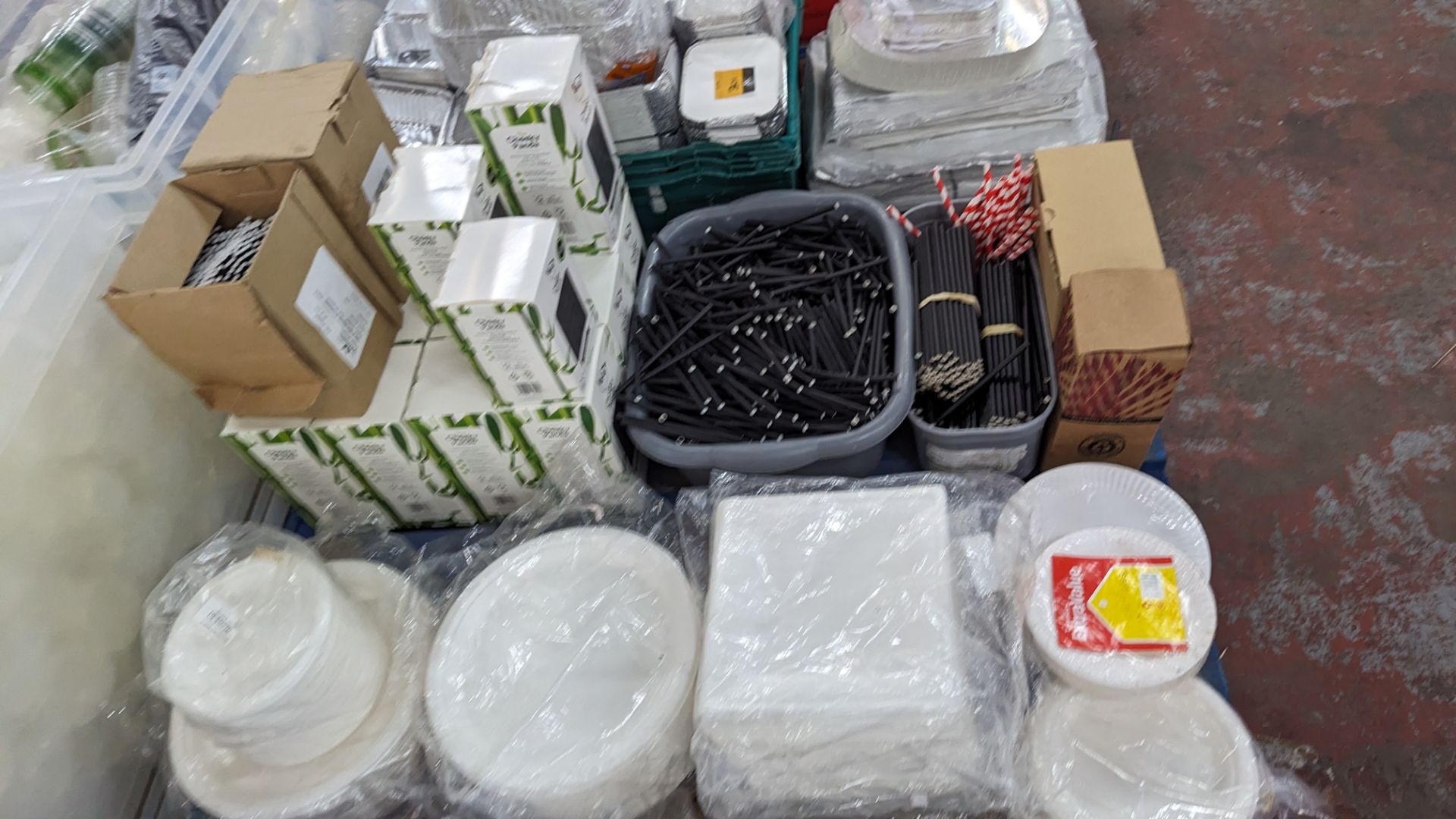 The contents of a pallet of disposable items including foil trays & lids, straws, plates & more. NB - Image 11 of 12