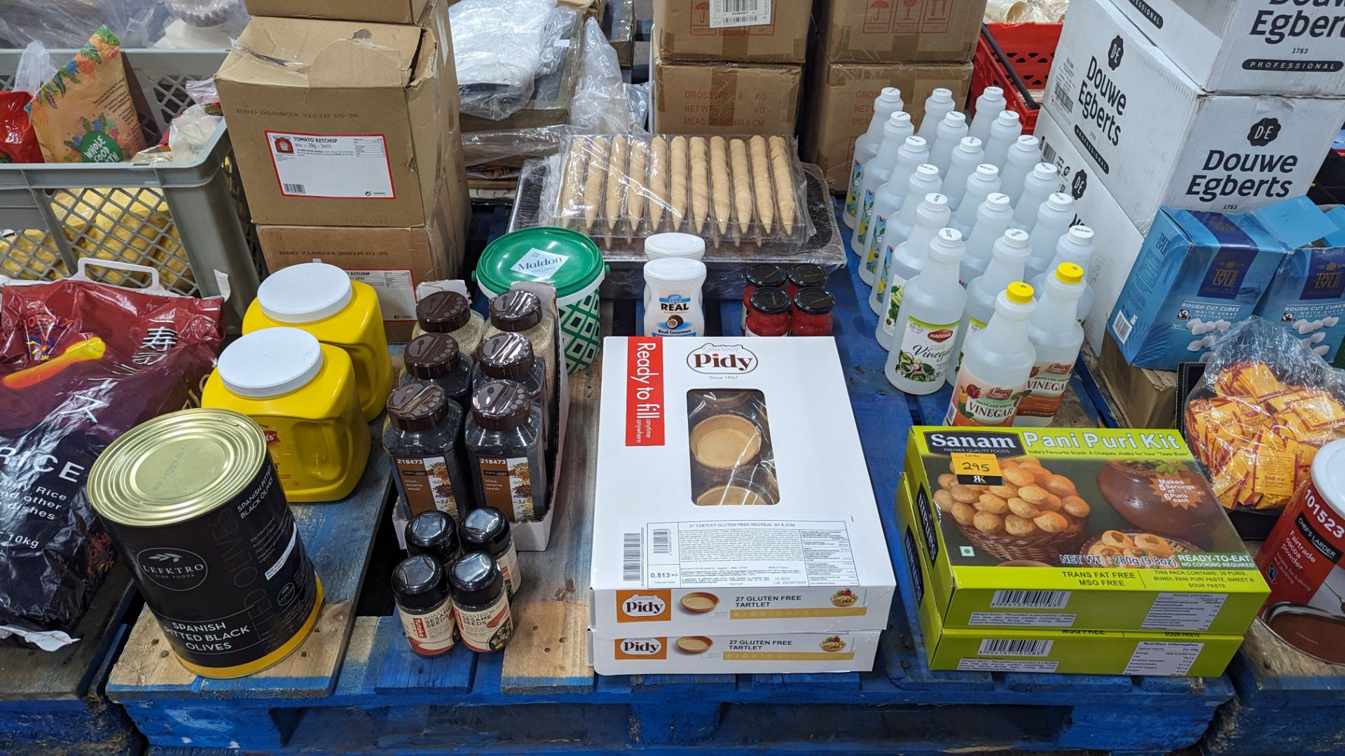 The contents of a pallet of food supplies including a large quantity of vinegar & a large quantity o