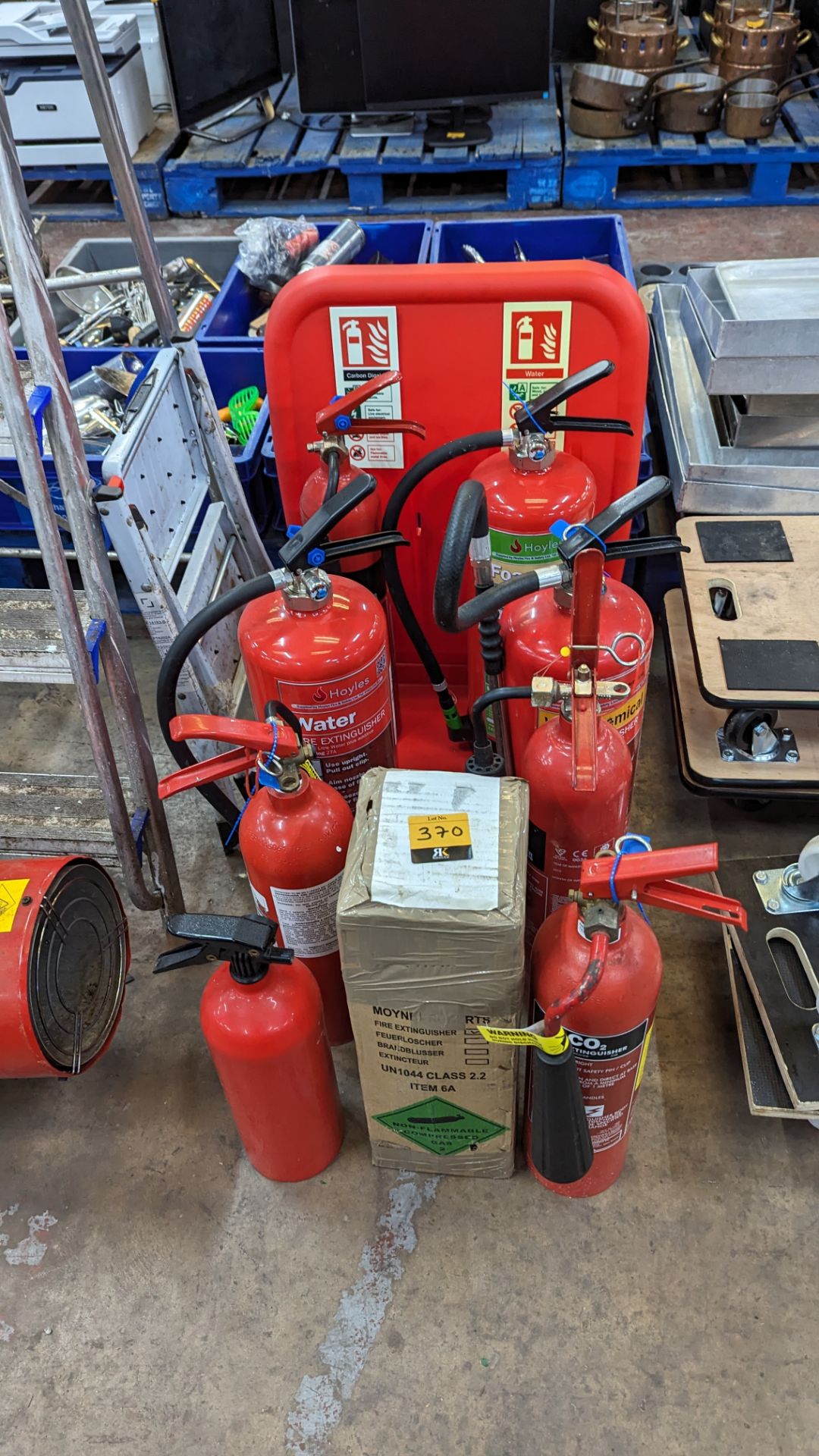 9 off fire extinguishers plus display stand for use with same