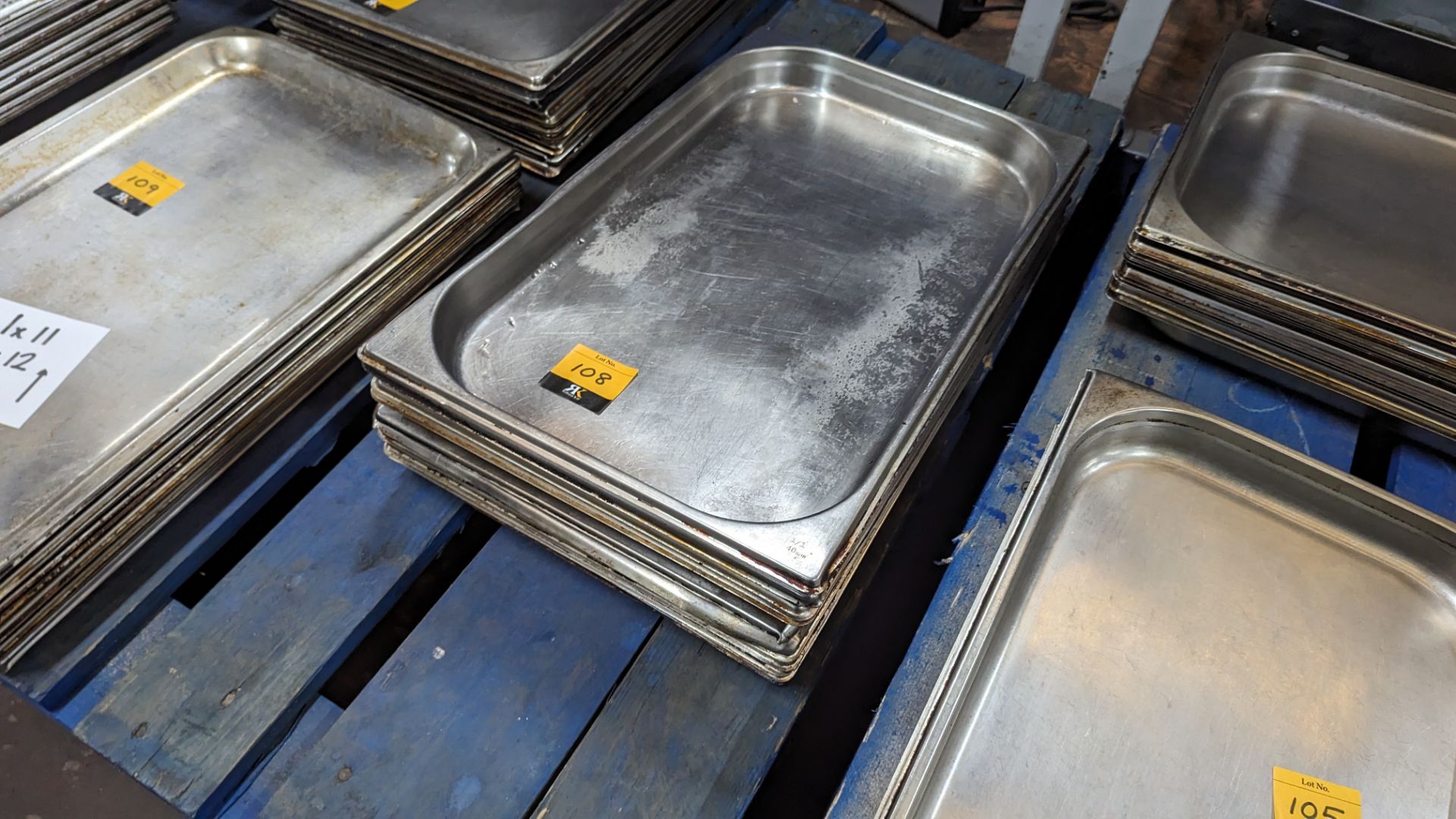 12 off stainless steel trays each measuring 530mm x 330mm x 50mm. NB these trays are shallower than