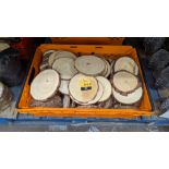 The contents of a crate of wooden decorative large coasters/serving bowl stands, each being typicall