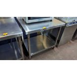Stainless steel twin tier table with upstand to the rear. Dimensions 900mm x 700mm x 950mm