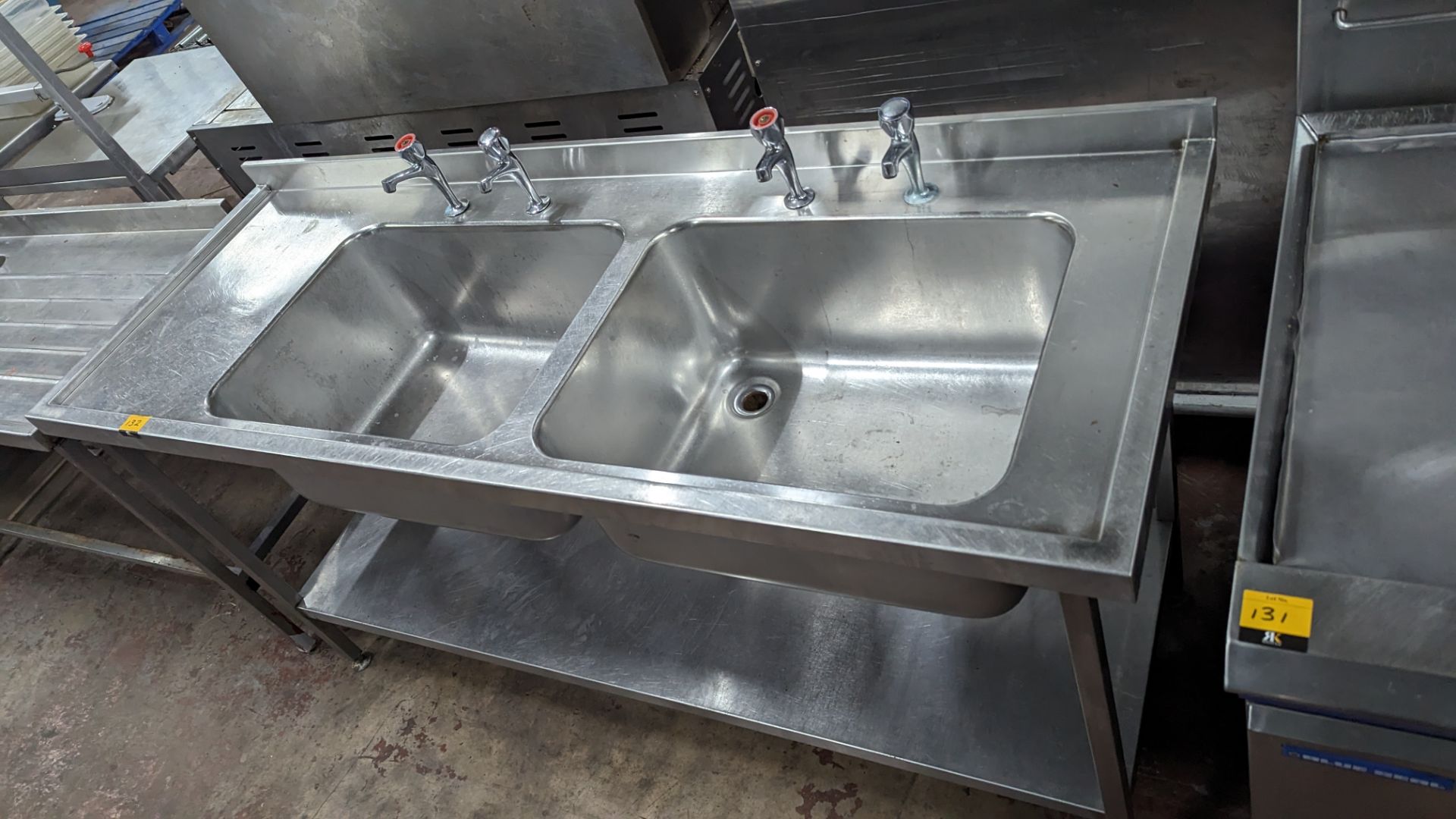 Large stainless steel floor standing twin bowl sink arrangement with built-in drainer & a pair of ta - Image 3 of 4