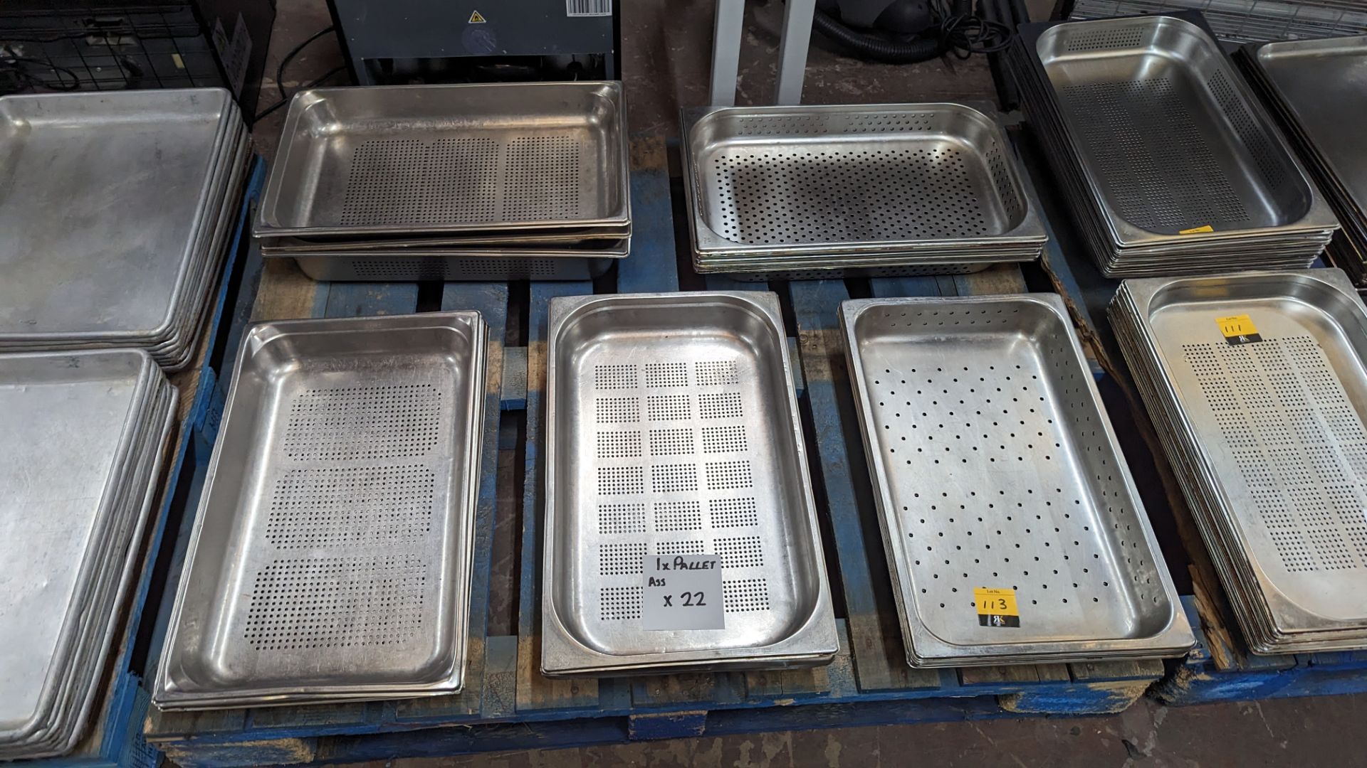 22 off assorted perforated stainless steel trays each measuring 530mm x 325mm - the contents of a pa
