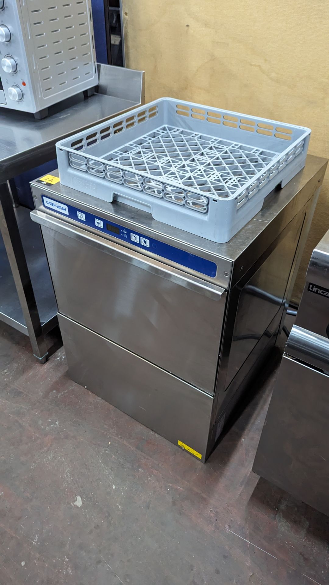 Cater-Wash stainless steel commercial dishwasher including a total of 3 trays
