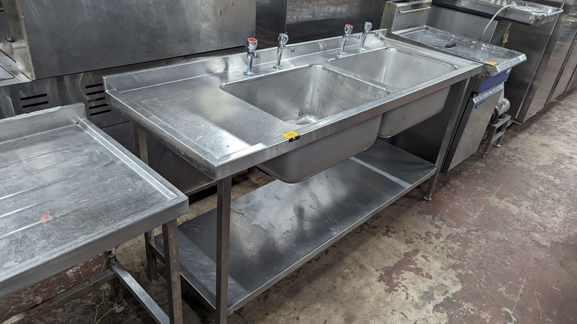 Large stainless steel floor standing twin bowl sink arrangement with built-in drainer & a pair of ta - Image 4 of 4