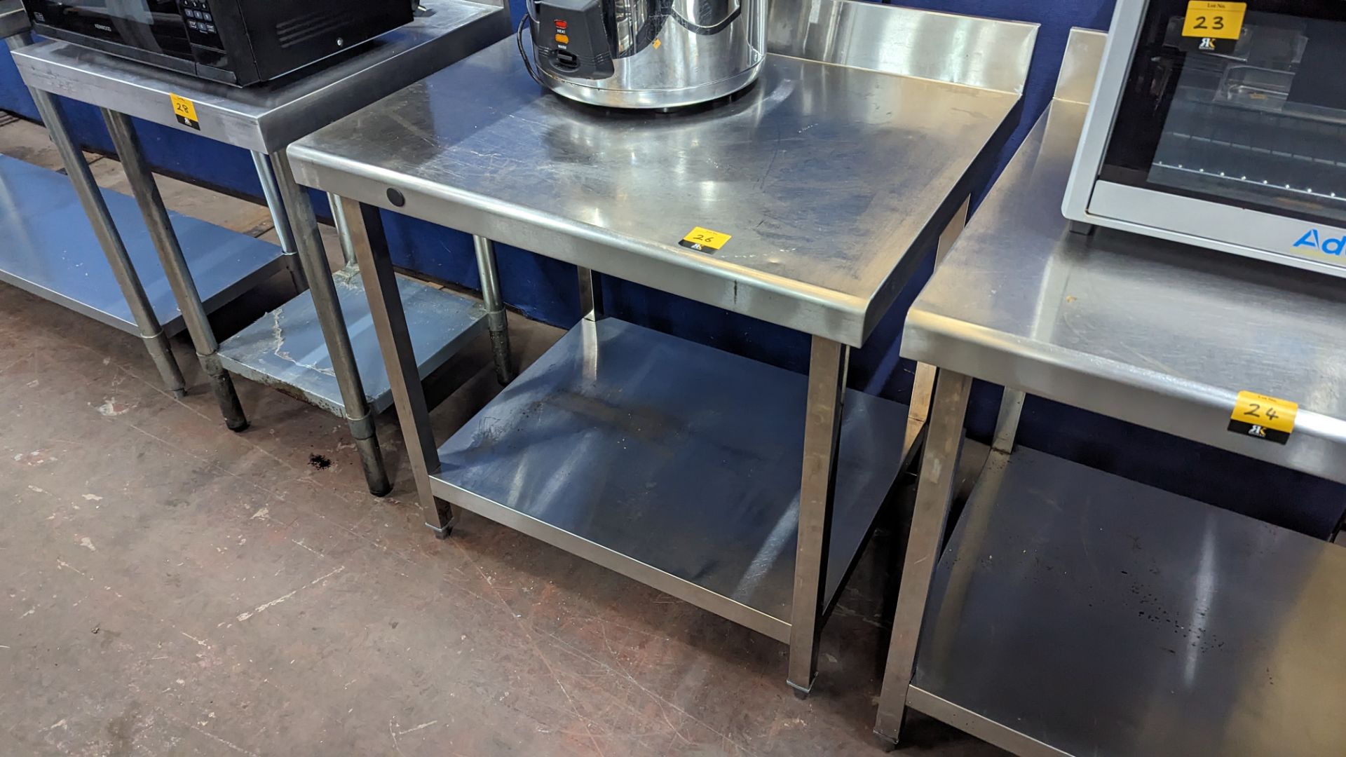 Stainless steel twin tier table with upstand to the rear. Dimensions 900mm x 700mm x 950mm - Image 2 of 3