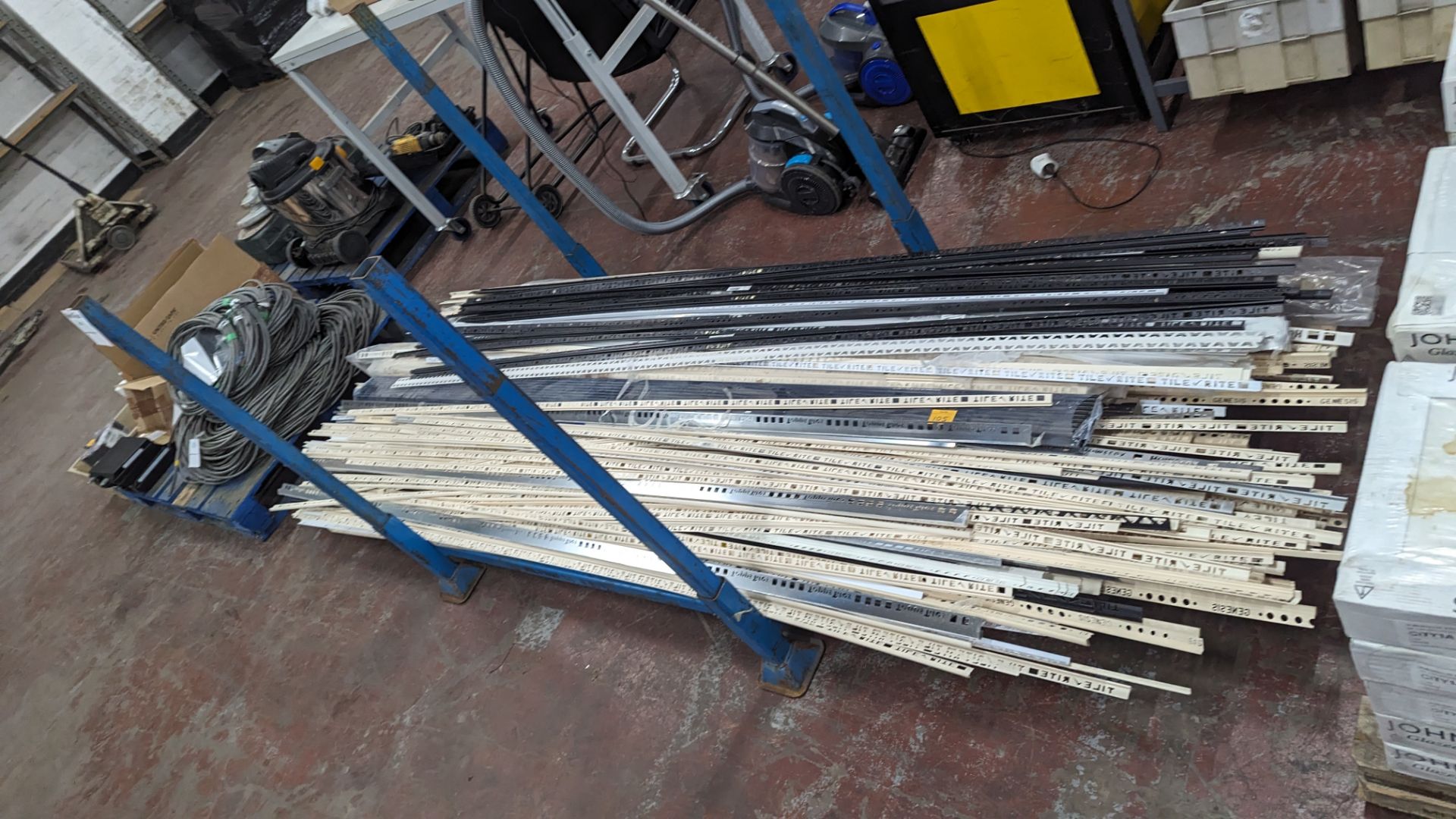 The contents of a stillage of Tile Rite, edging strips and other products. NB: stillage excluded