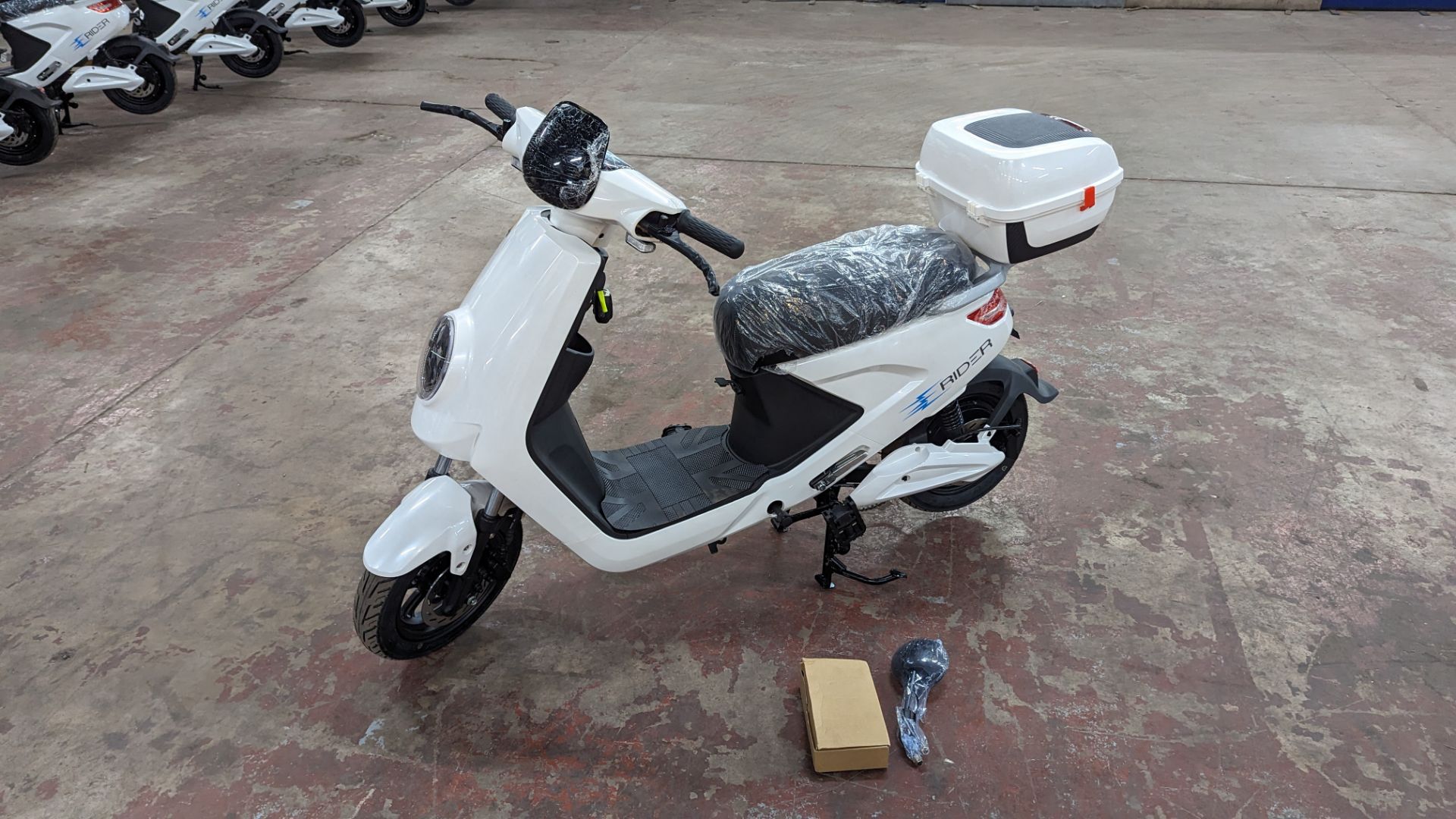 Model 18 Electric Bike: Zero (0) recorded miles, white body with black detailing, lockable storage b