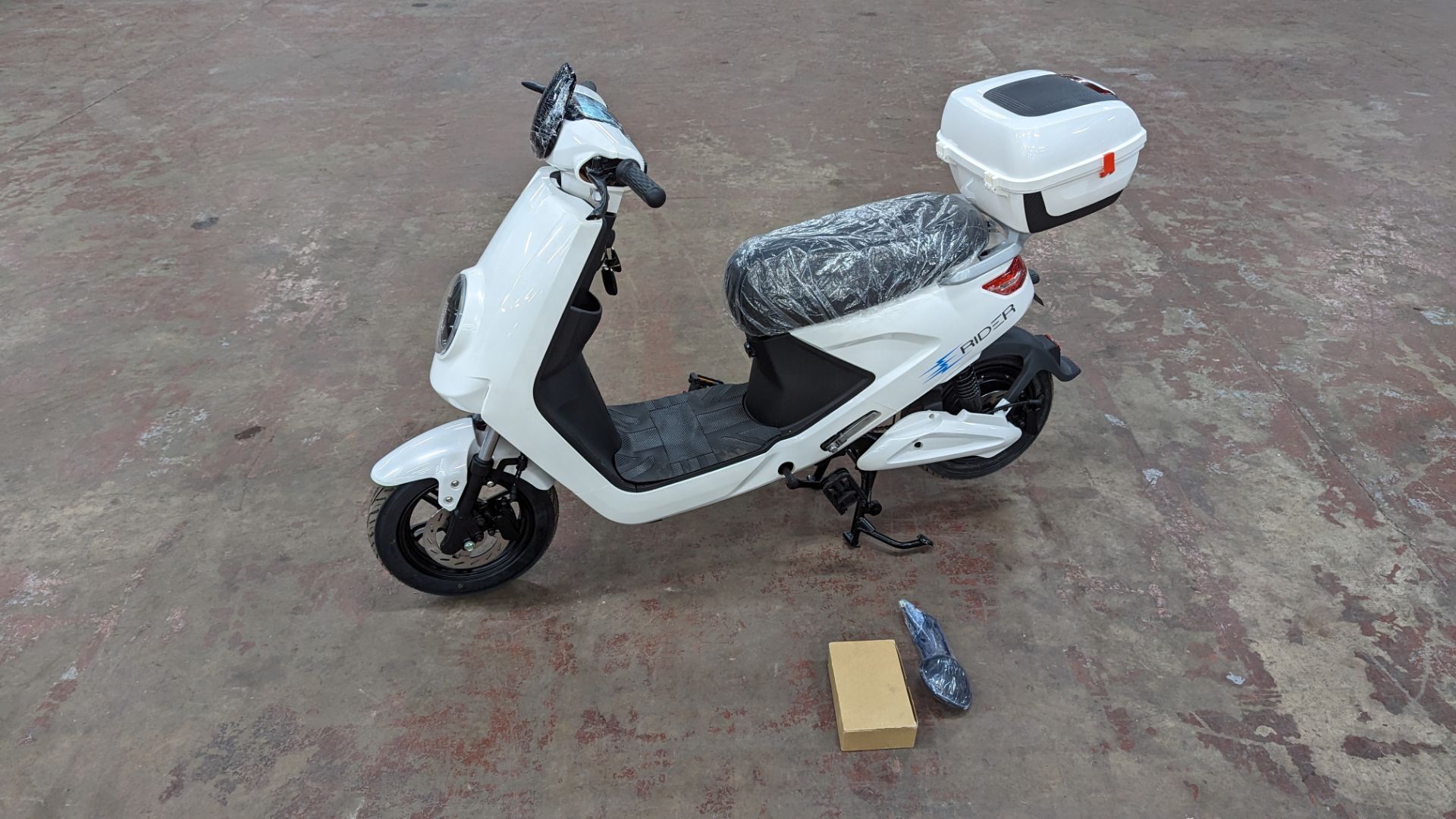 Model 18 Electric Bike: Zero (0) recorded miles, white body with black detailing, lockable storage b