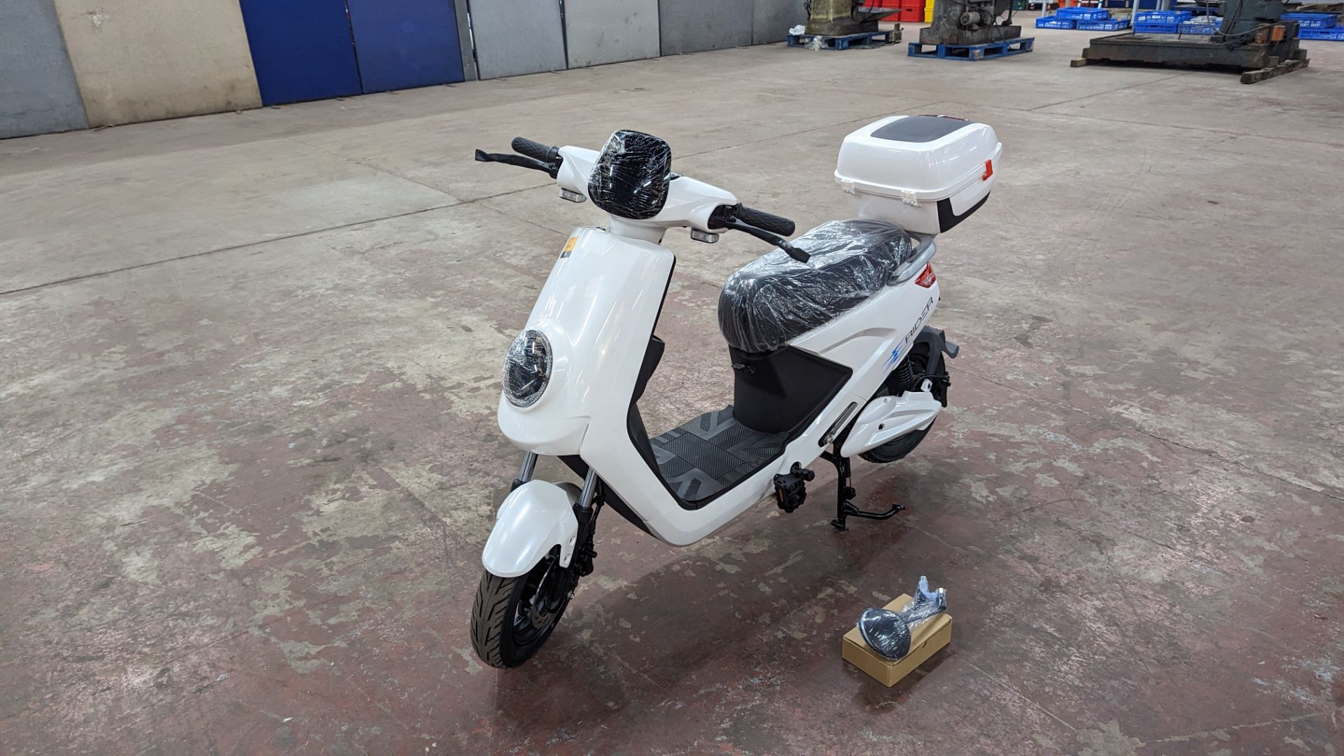 Model 18 Electric Bike: Zero (0) recorded miles, white body with black detailing, lockable storage b