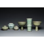 Three Chinese celadon-glazed vases, two stem cups and a blue and white vase, Ming