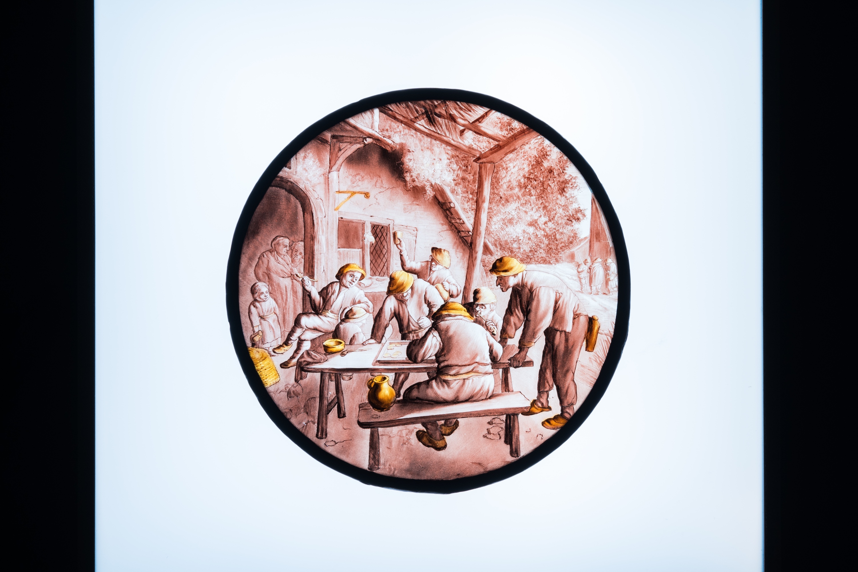 A painted glass roundel with 'The Backgammon-players' after Adriaen van Ostade, Southern Netherlands - Image 3 of 4