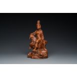 A Chinese wood sculpture of the seated Tara, 19th C.