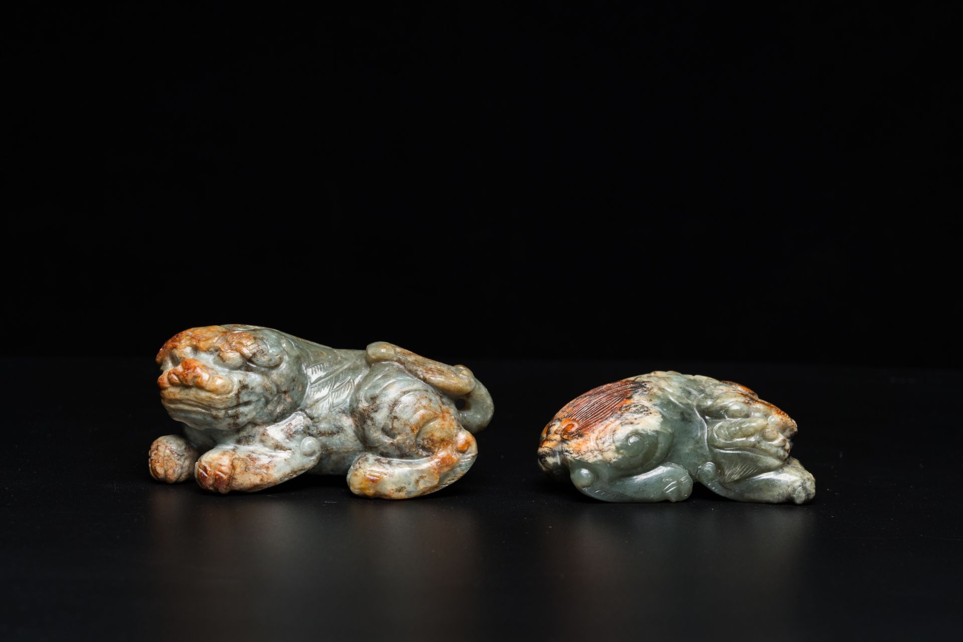 Two Chinese celadon and russet jade Buddhist lion sculptures, Qing - Image 2 of 21