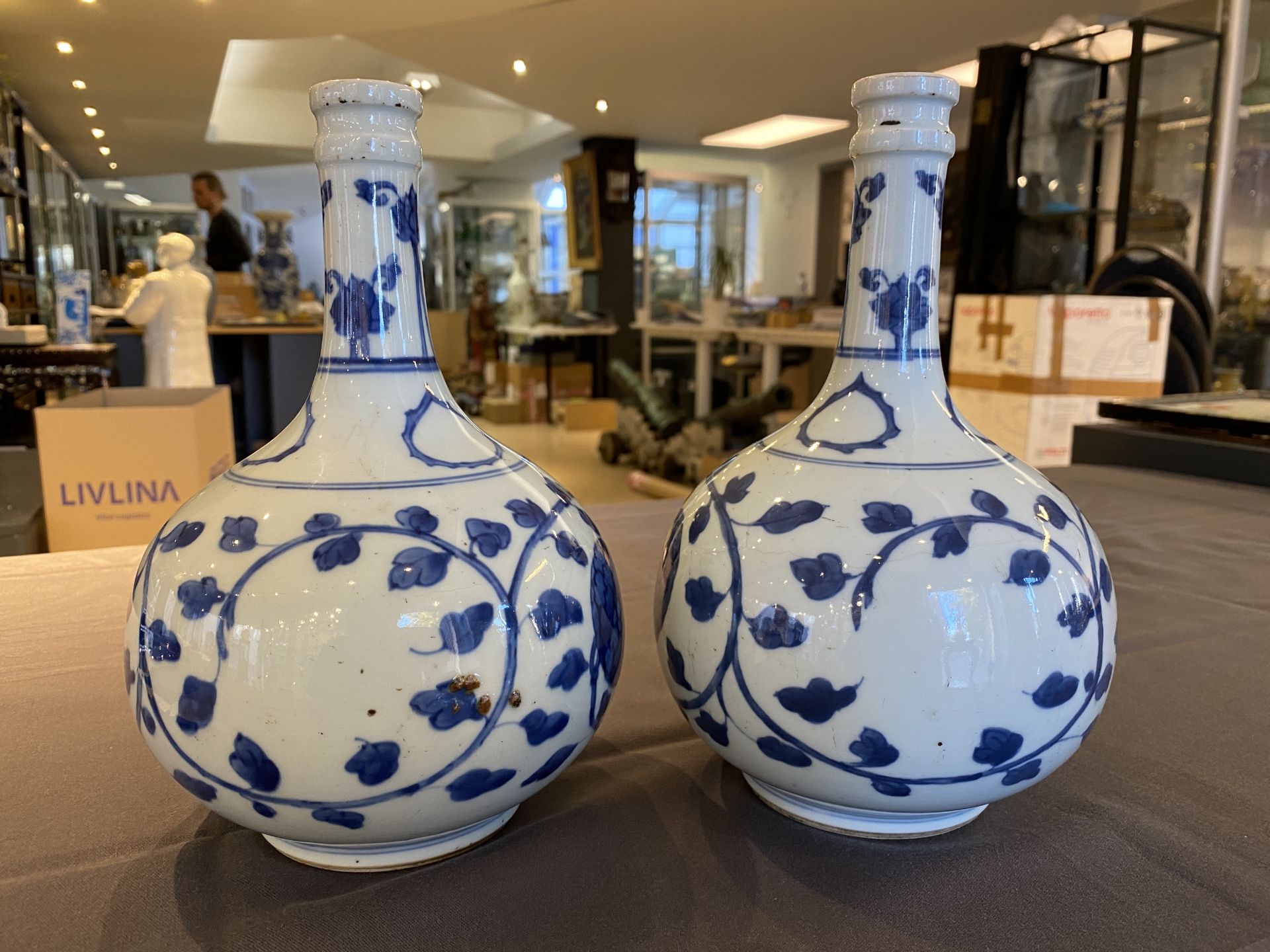 A pair of Chinese blue and white 'peony scroll' pharmacy bottles, Kangxi - Image 8 of 20