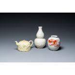 A Chinese yellow-glazed biscuit teapot, a white-glazed biscuit double gourd vase and an iron-red 'ph