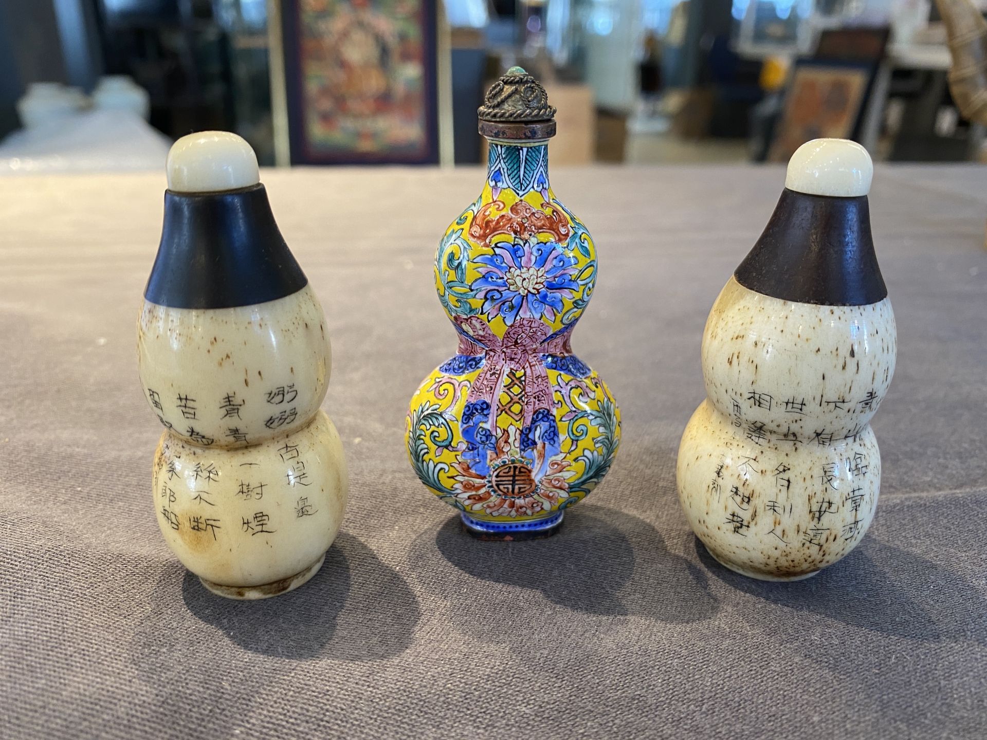 A Chinese Canton enamel snuff bottle and a pair of bone snuff bottles, 19th C. - Image 8 of 22