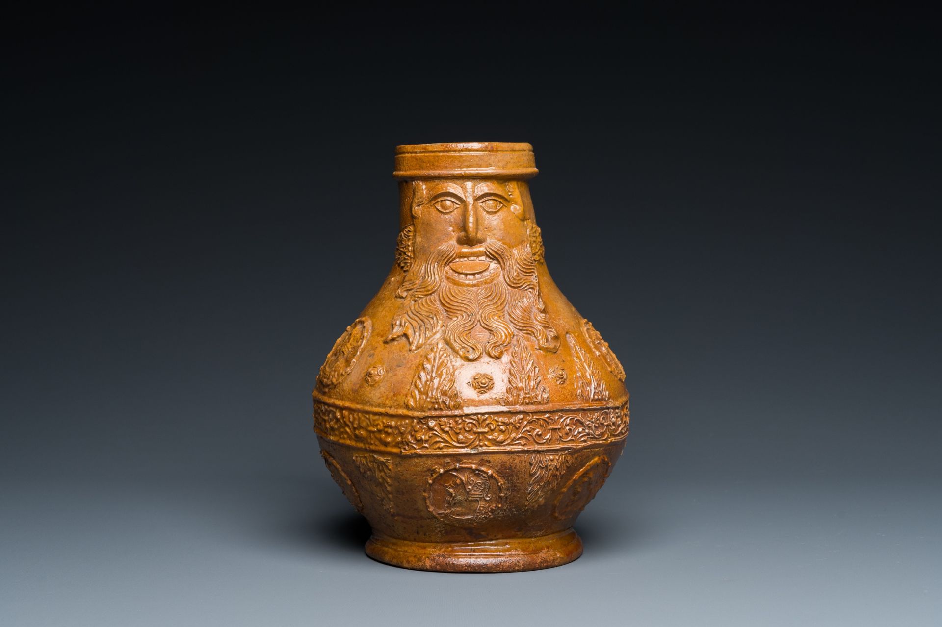 A rare German stoneware bellarmine jug with a bearded face sticking his tongue out, Cologne, 16th C. - Image 3 of 10