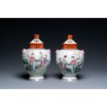 A pair of Chinese famille rose vases with reticulated covers, Qianlong mark, Republic