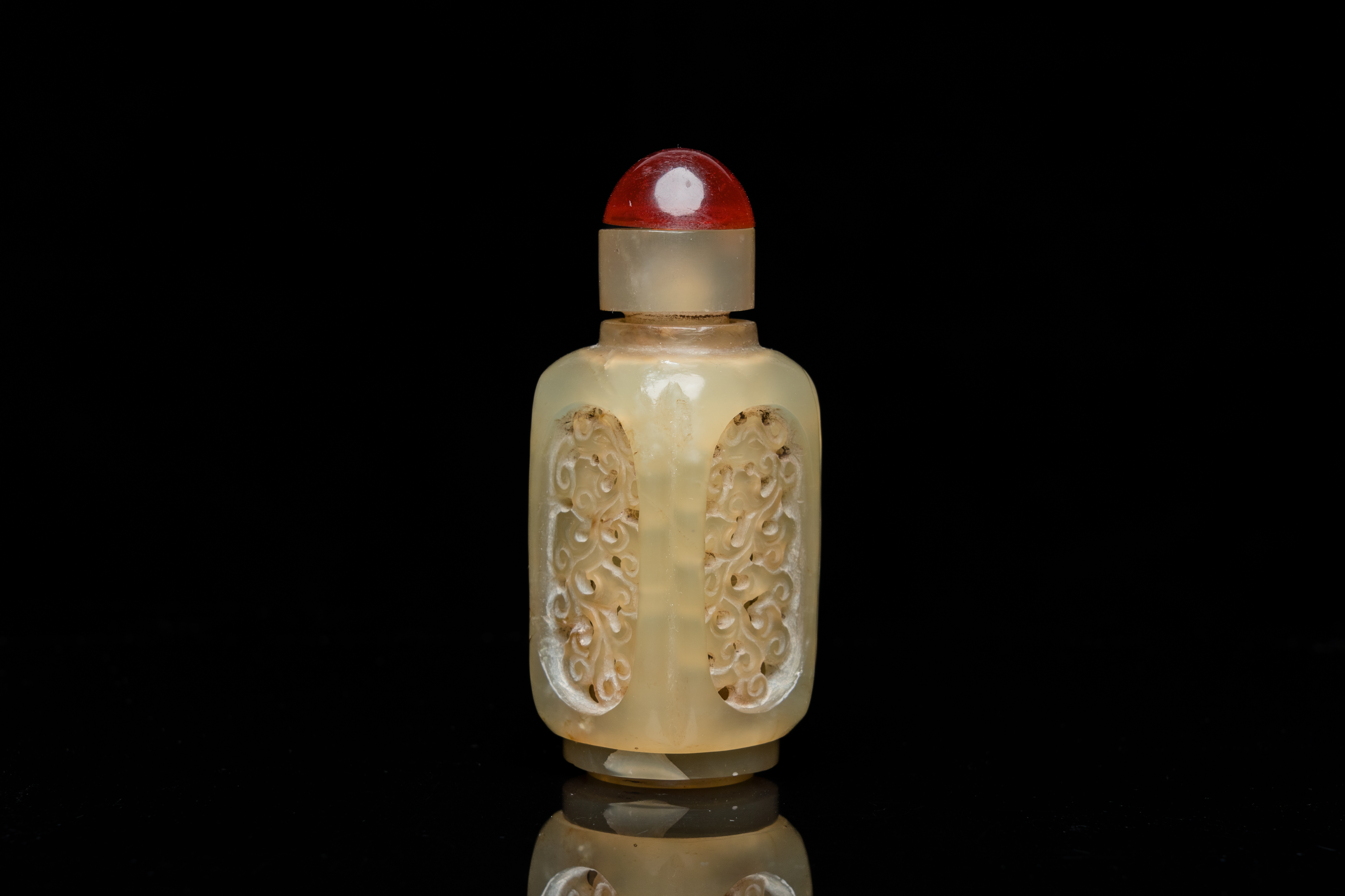 A Chinese reticulated and movable celadon jade snuff bottle, Qing