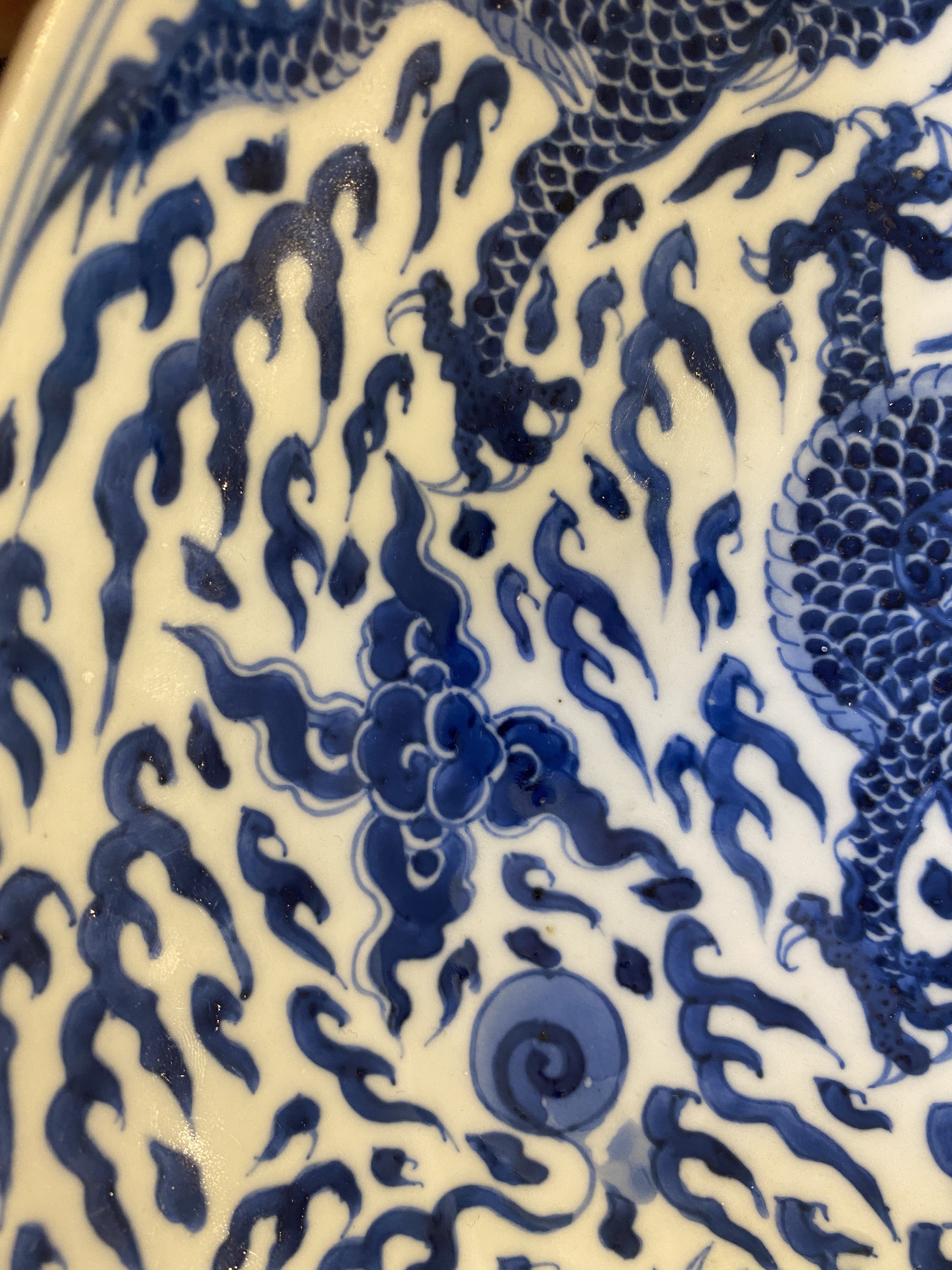 A Chinese blue and white 'dragon' dish, Kangxi mark and of the period - Image 7 of 18