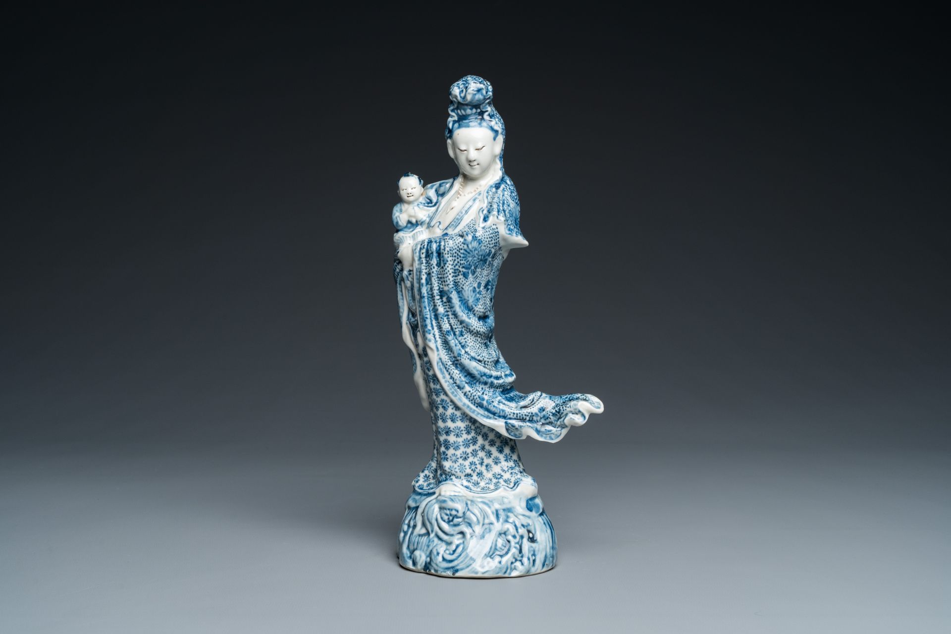 A Chinese blue and white Guanyin with child, Cai Fu Ji ___ mark, Republic