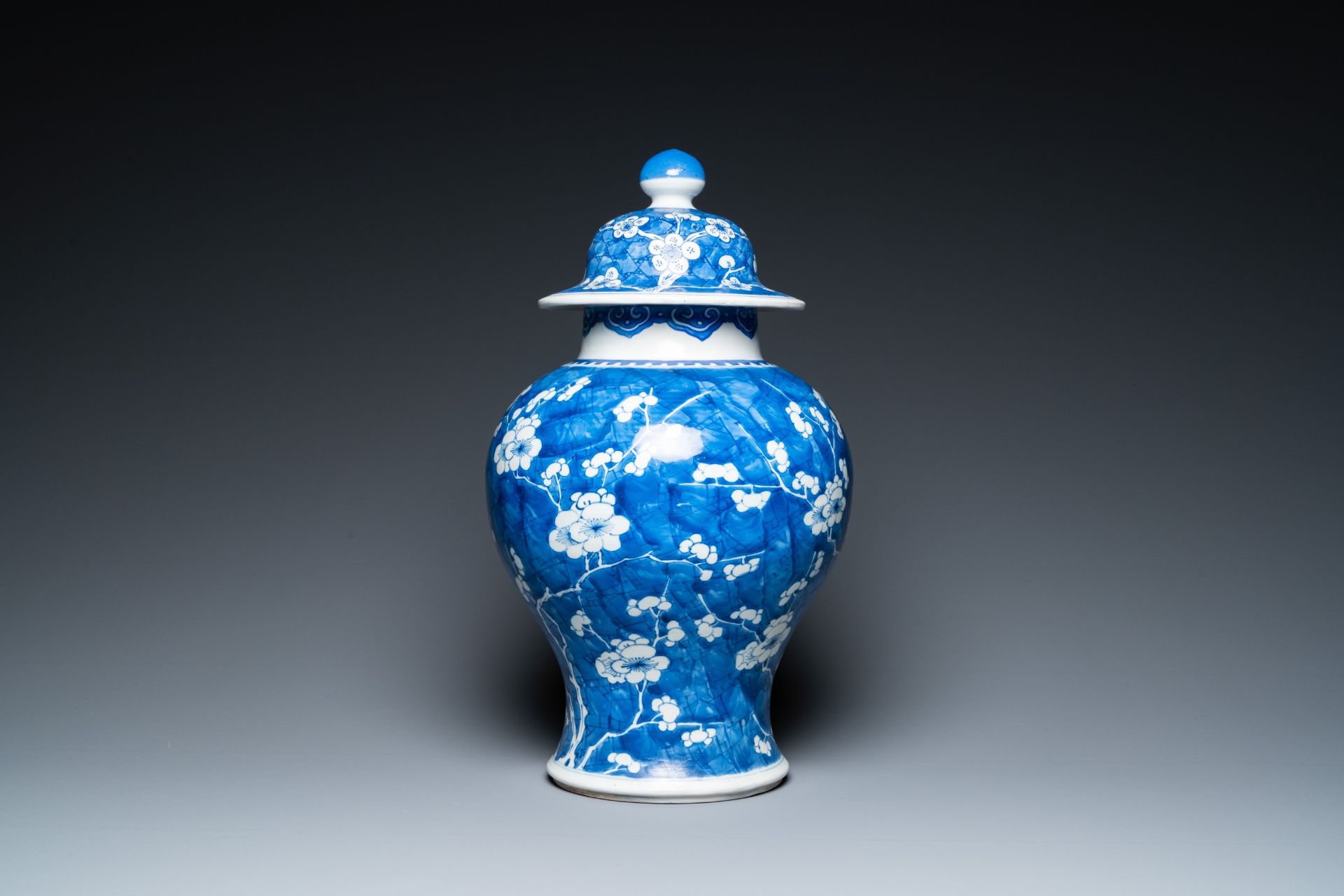 A Chinese blue and white 'prunus on cracked ice' vase and cover, Kangxi - Image 3 of 29