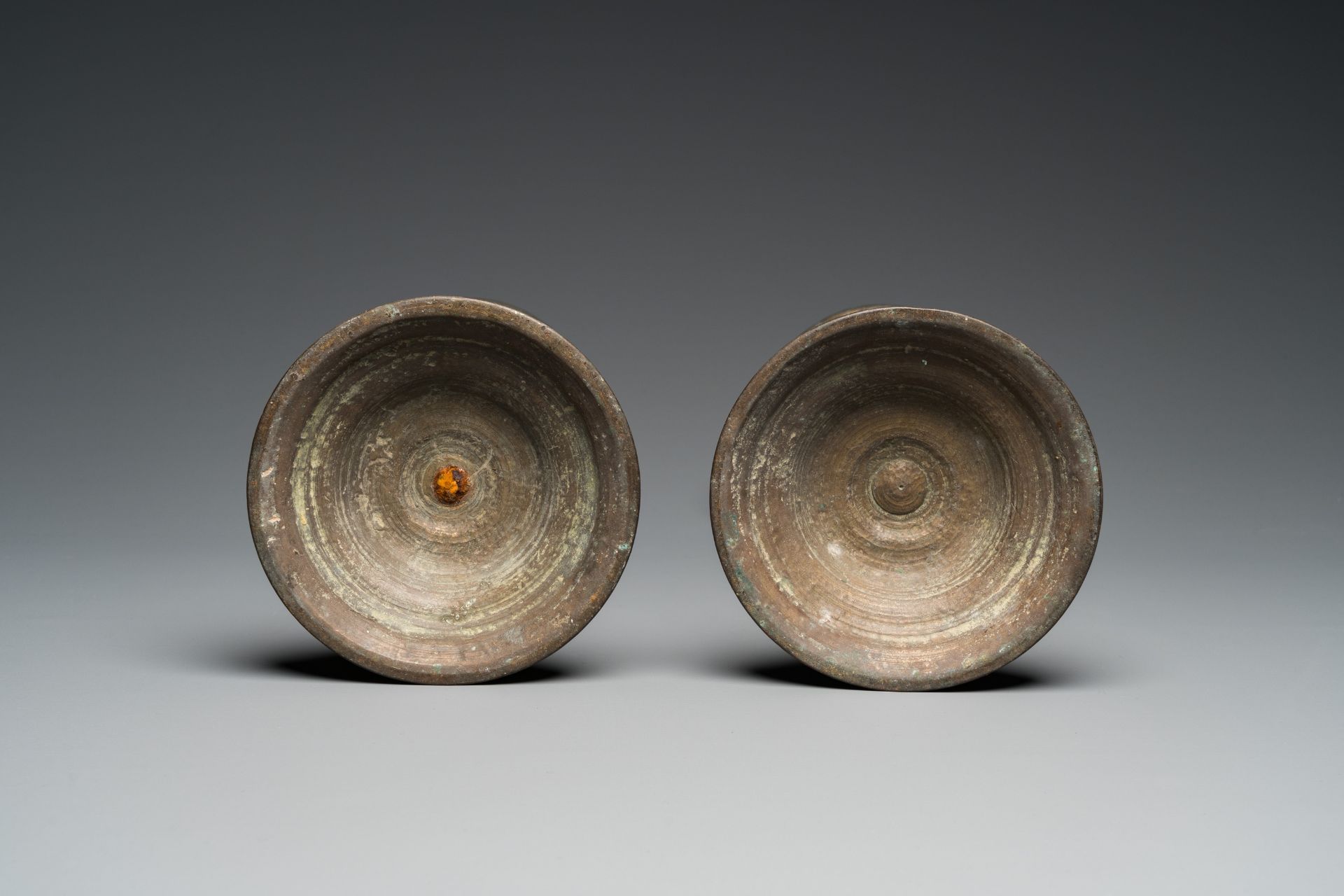 A pair of patinated bronze pricket candlesticks, France, 17th C. - Image 7 of 7