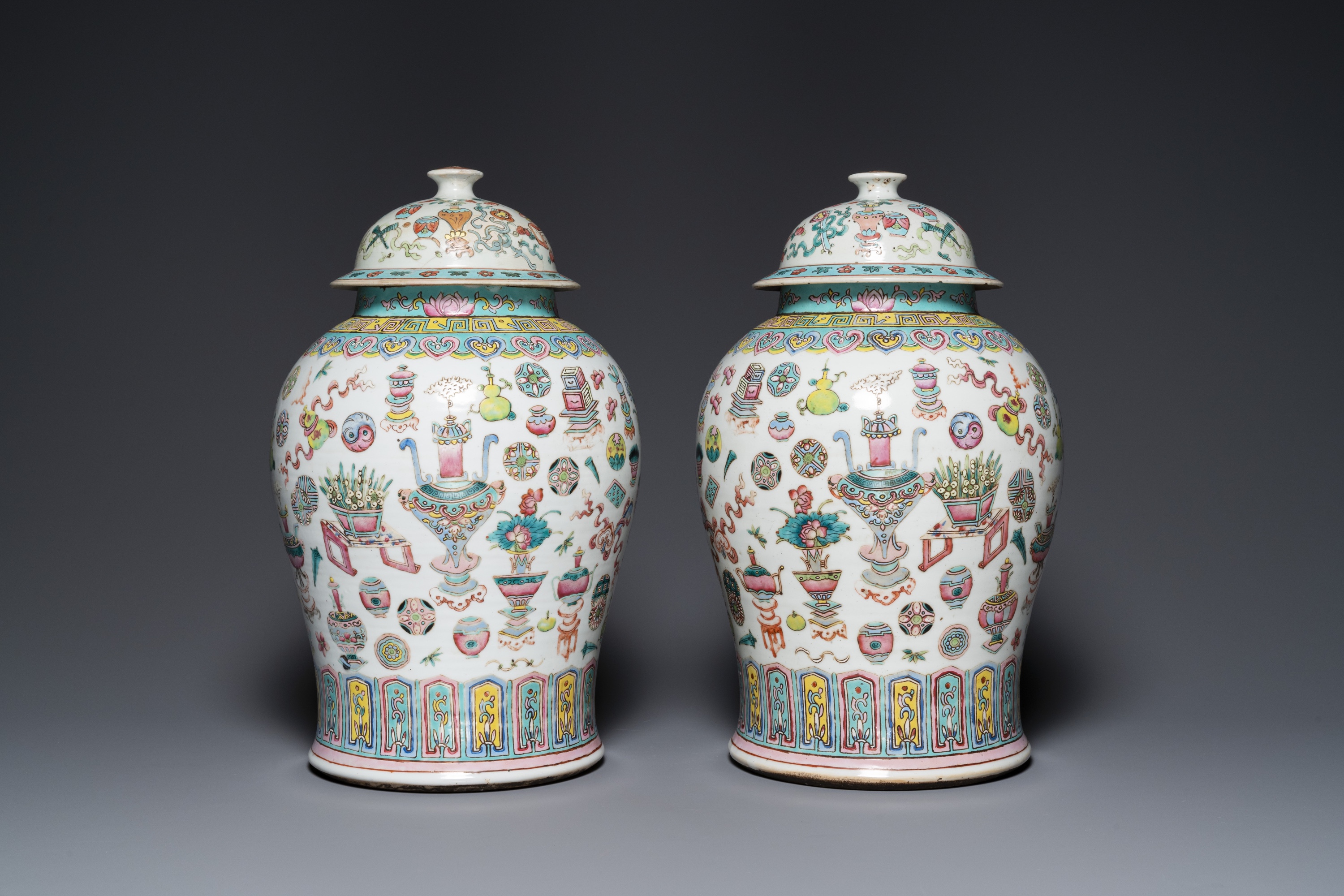 A pair of Chinese famille rose 'antiquities' vases and covers, 19th C. - Image 3 of 8