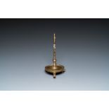 A Flemish or Dutch bronze candlestick, 14/15th C.