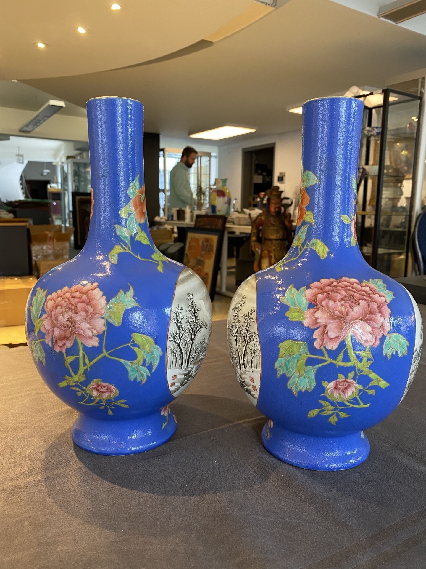 A pair of Chinese blue-ground famille rose vases, He Xuren ___ seal mark, 20th C. - Image 9 of 28