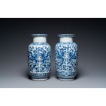 A pair of Chinese blue and white 'phoenix' vases, Kangxi mark, 19th C.