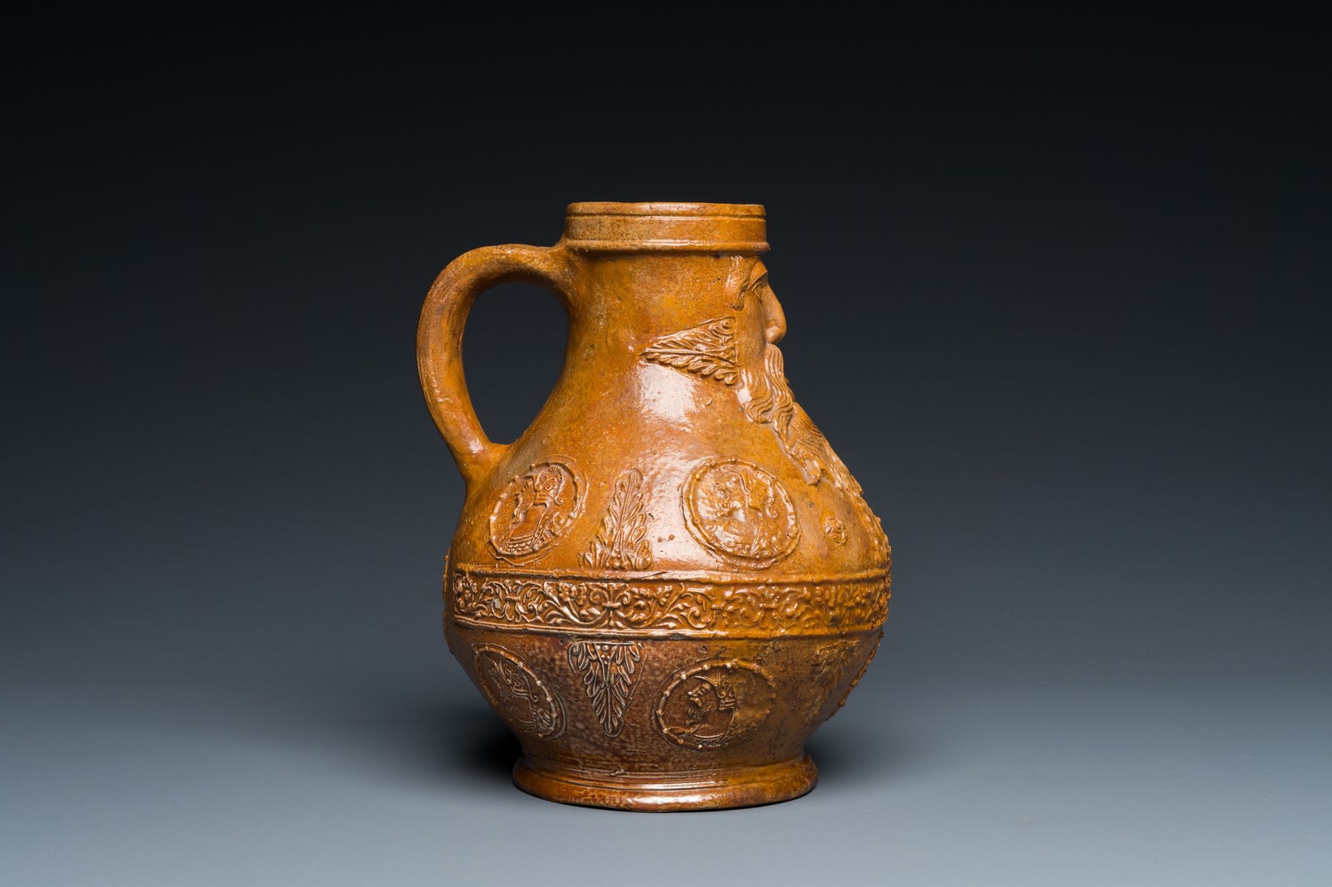 A rare German stoneware bellarmine jug with a bearded face sticking his tongue out, Cologne, 16th C. - Image 6 of 10
