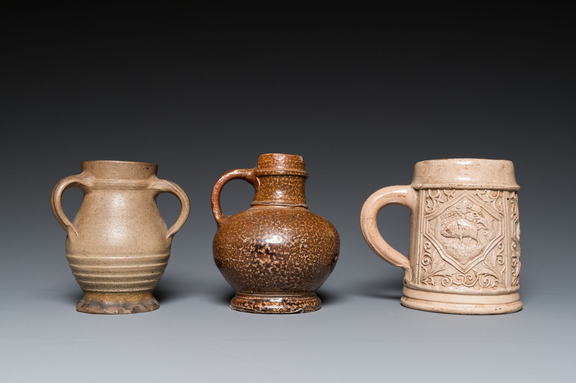 A German stoneware mug and two jugs, Raeren and Cologne, 16/17th C. - Image 4 of 7