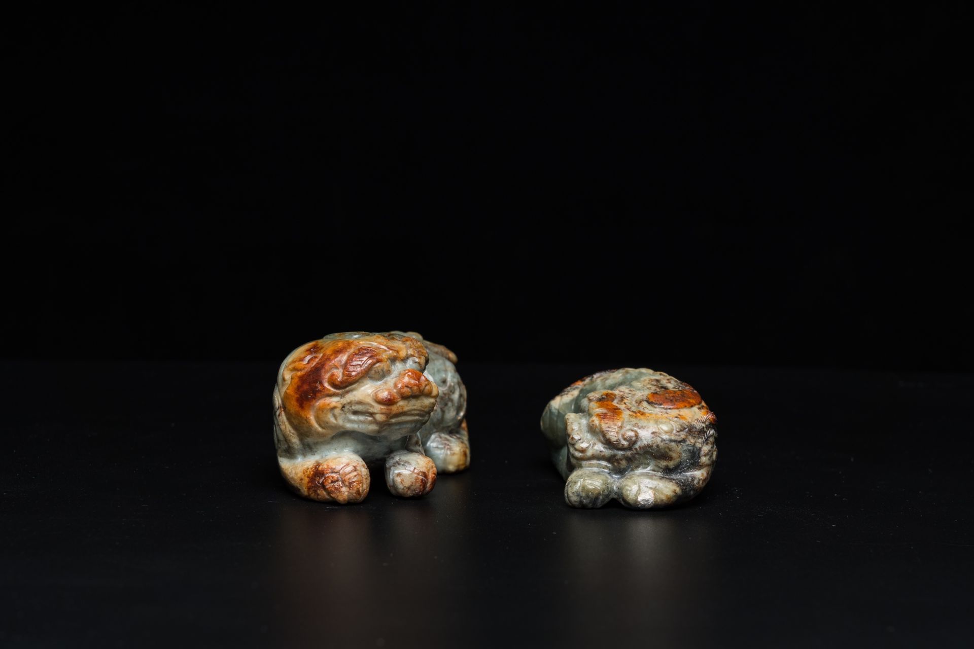 Two Chinese celadon and russet jade Buddhist lion sculptures, Qing - Image 3 of 21