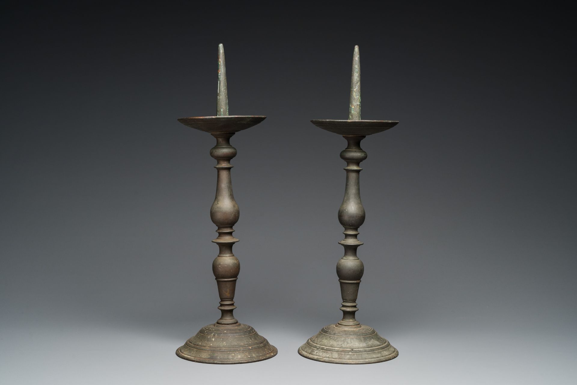 A pair of patinated bronze pricket candlesticks, France, 17th C. - Image 3 of 7