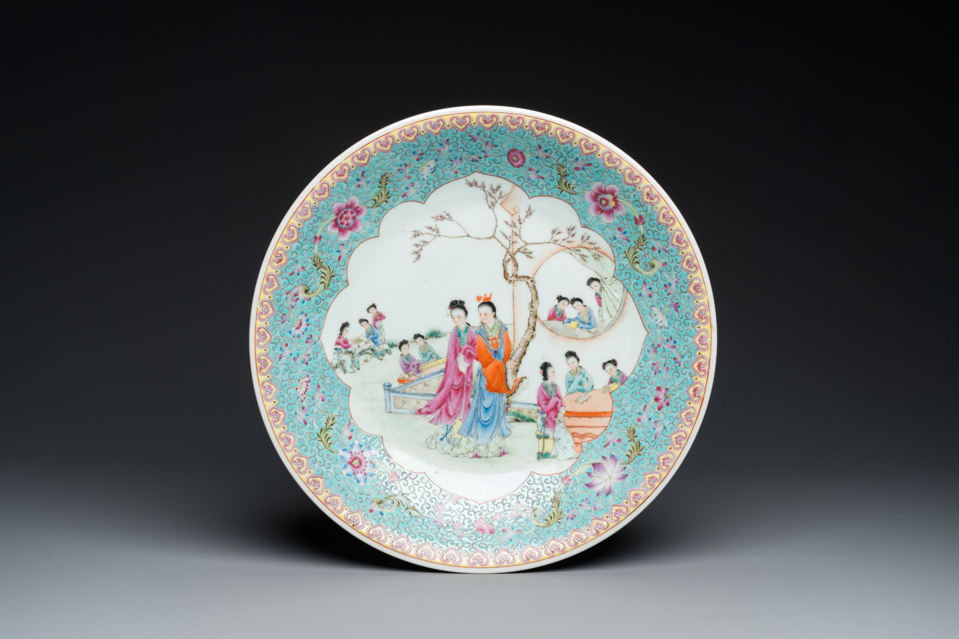 A Chinese famille rose dish with figures in a garden, Qianlong mark, Republic