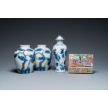 A pair of Chinese blue, white and copper-red vases, a blue and white covered vase and a Canton famil