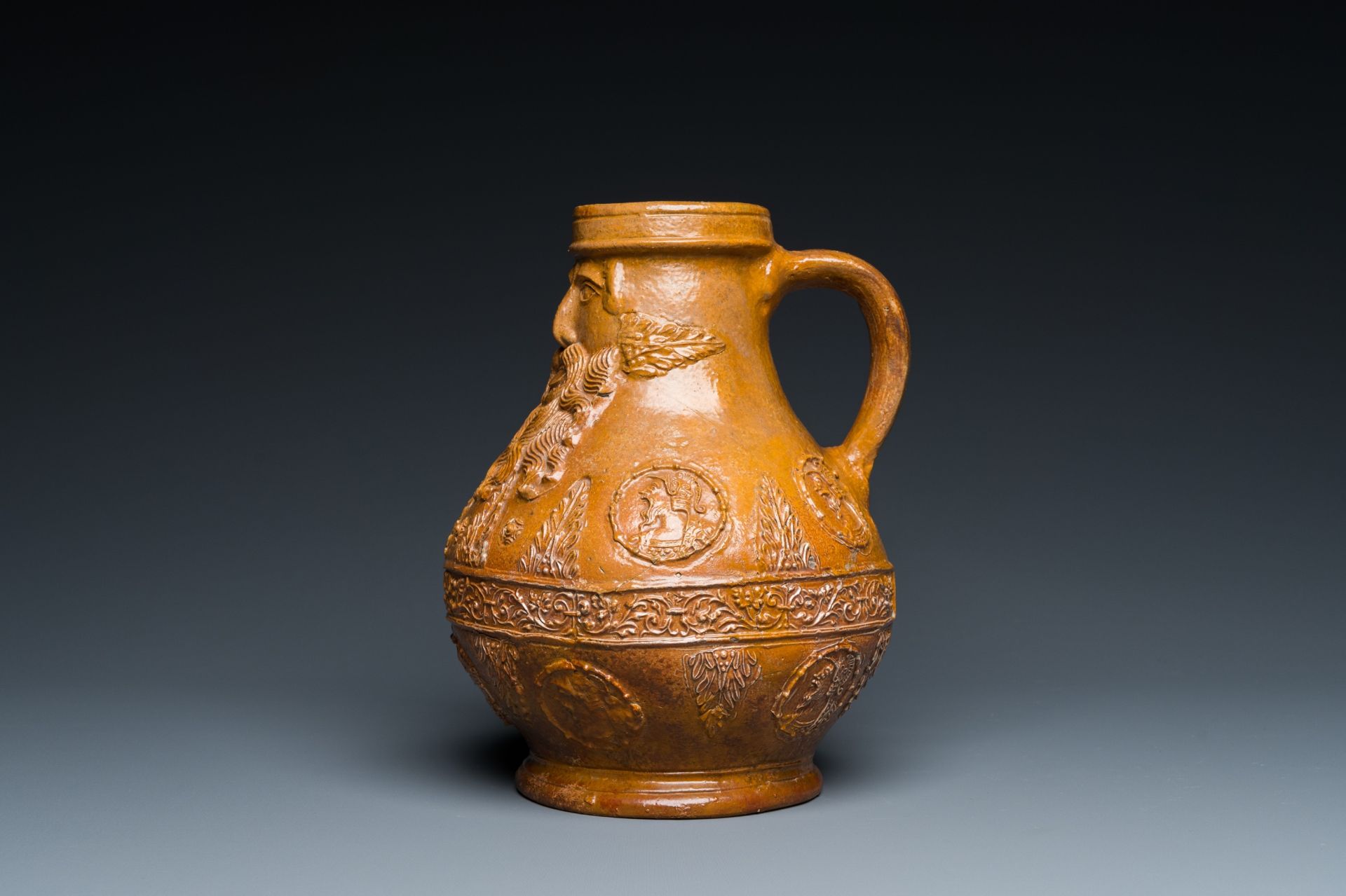 A rare German stoneware bellarmine jug with a bearded face sticking his tongue out, Cologne, 16th C. - Image 4 of 10