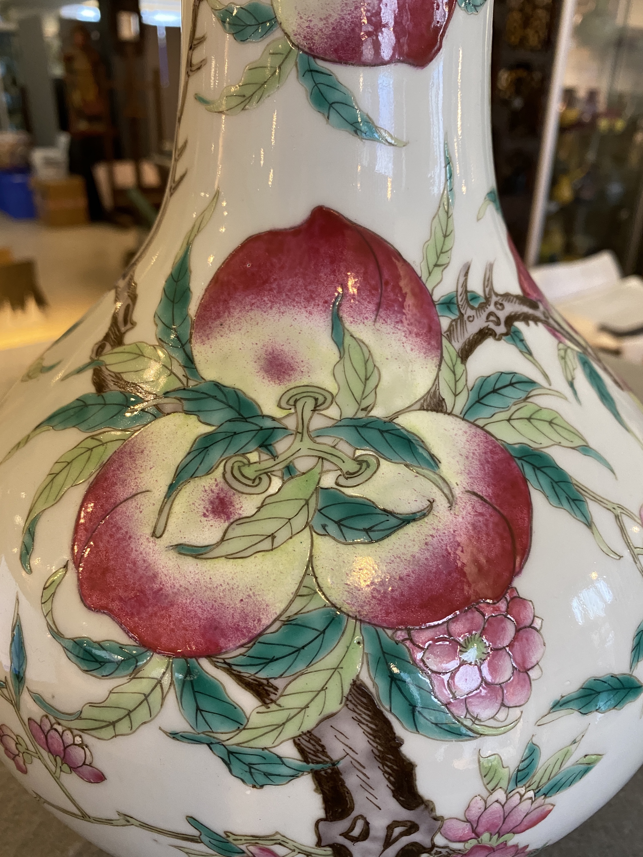 A Chinese famille rose 'nine peaches' bottle vase, 19th C. - Image 11 of 18