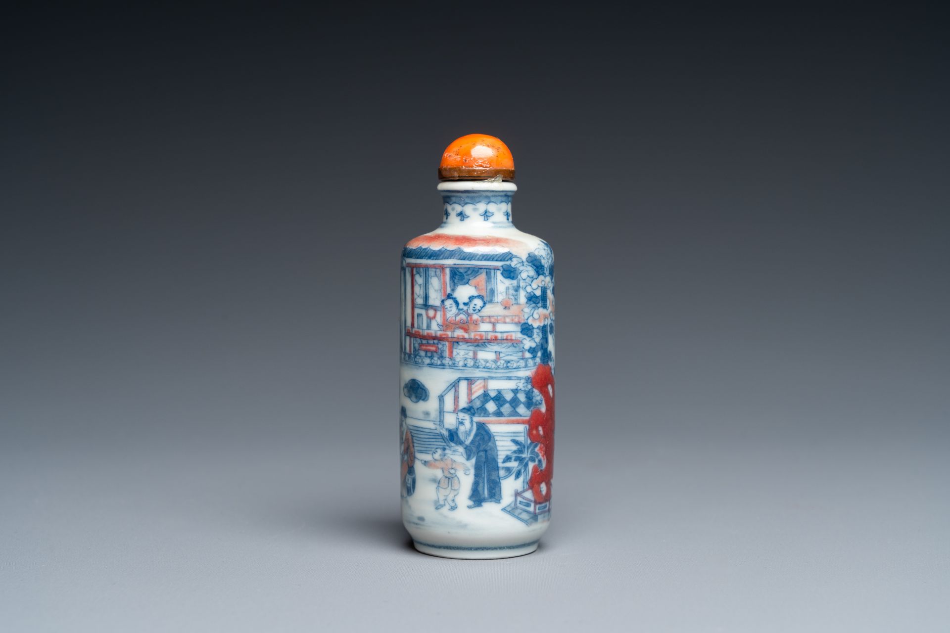 A Chinese blue, white and copper-red snuff bottle, 19th C.