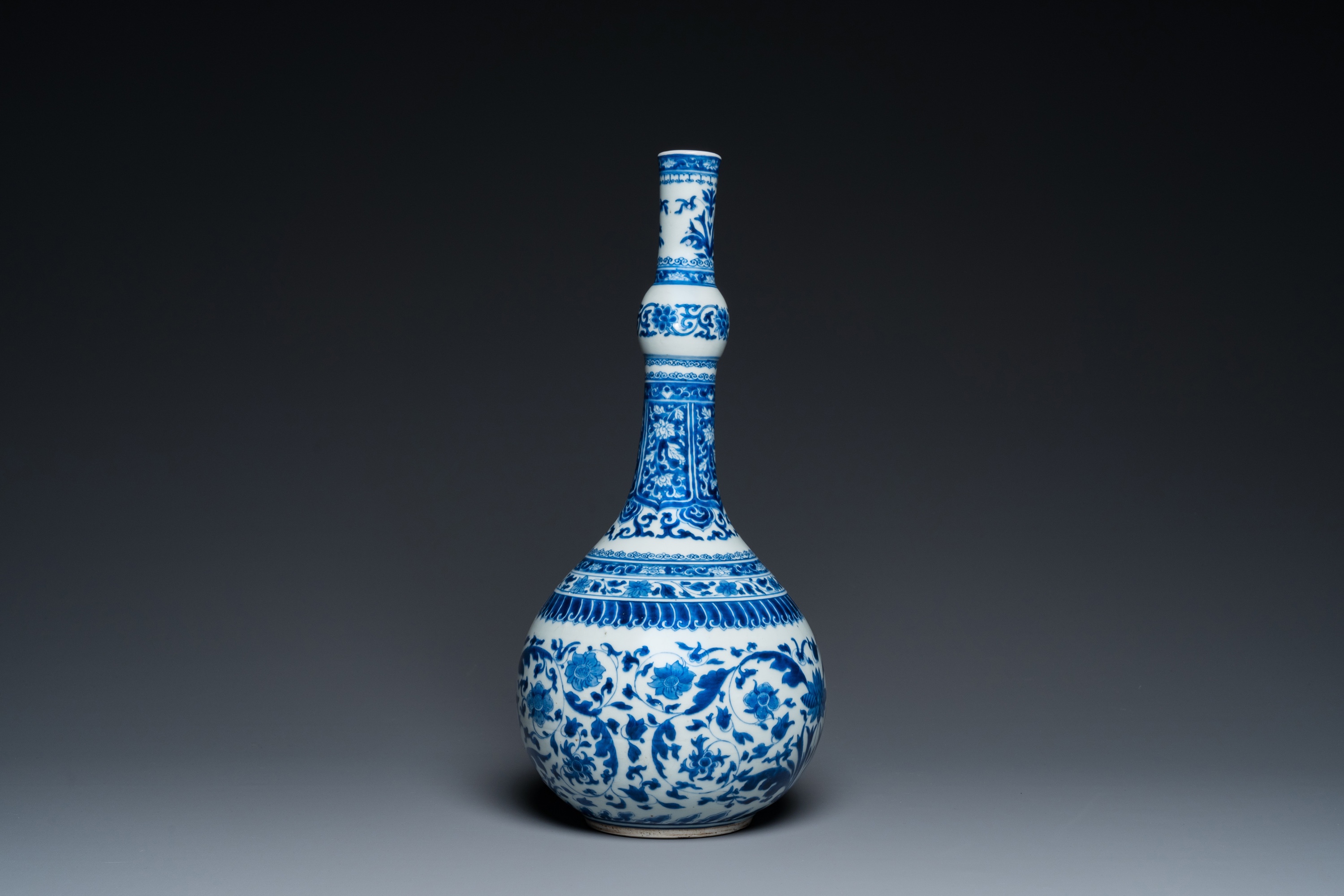 A Chinese blue and white bottle vase with floral design, Kangxi - Image 5 of 23