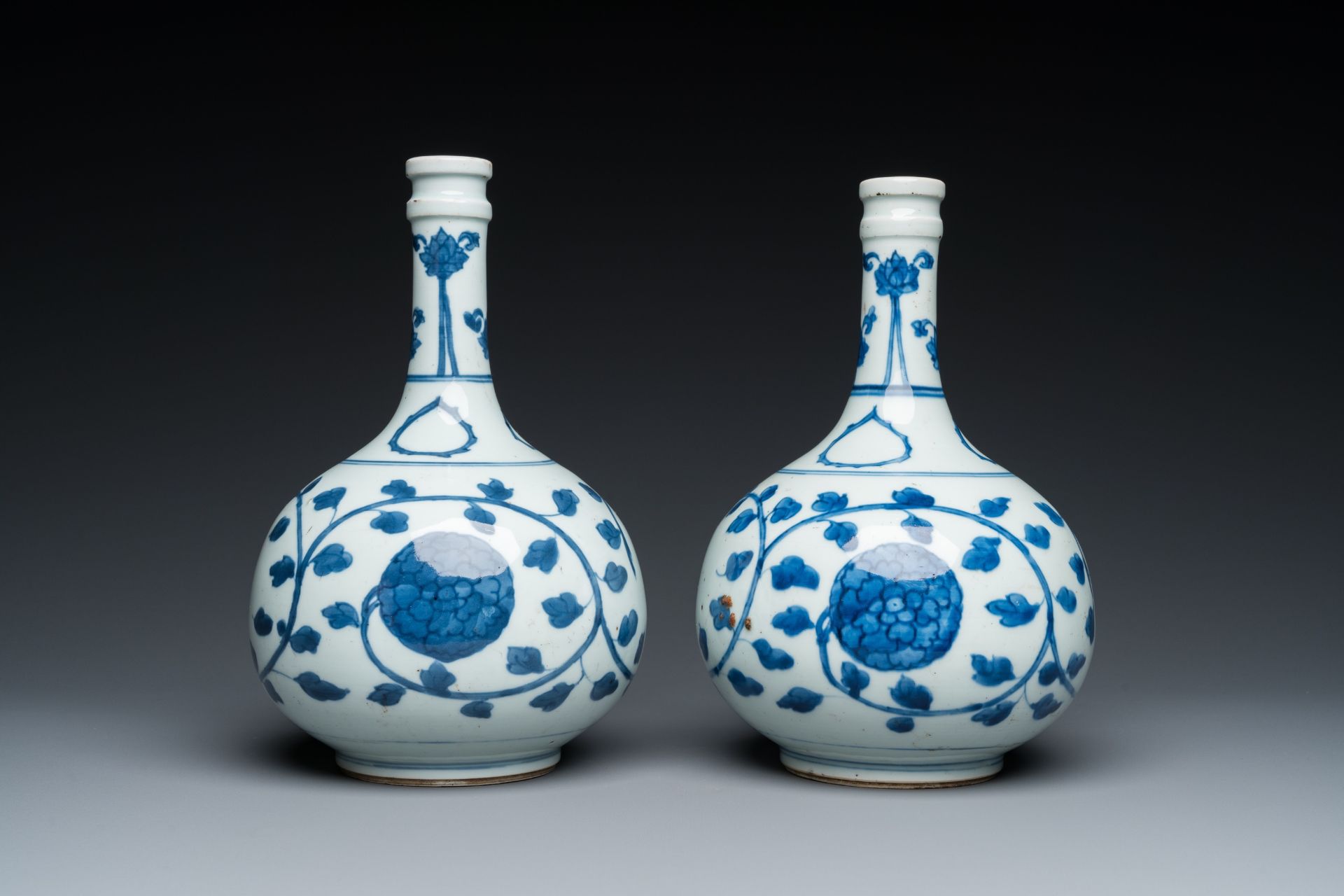 A pair of Chinese blue and white 'peony scroll' pharmacy bottles, Kangxi - Image 3 of 20