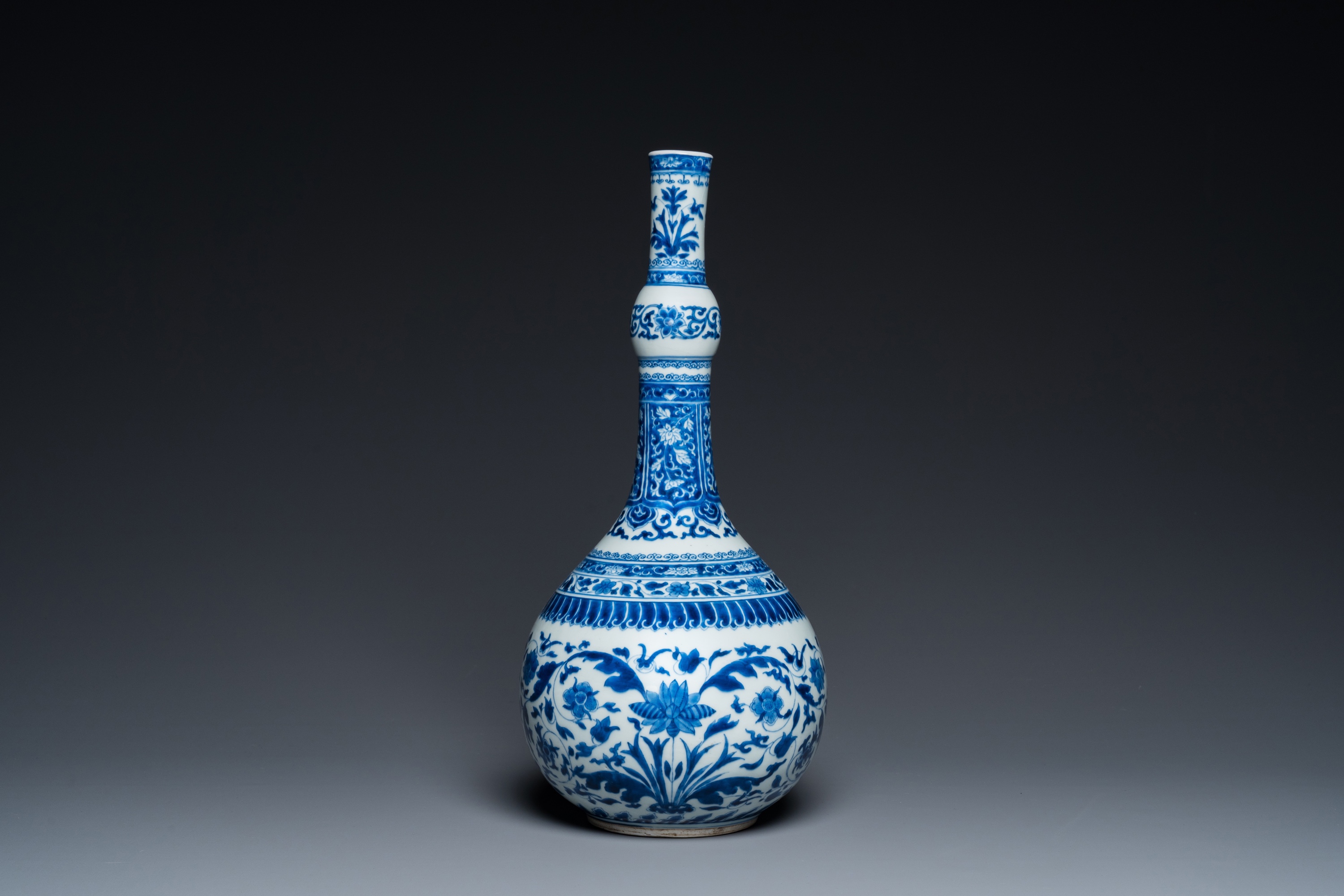 A Chinese blue and white bottle vase with floral design, Kangxi - Image 2 of 23