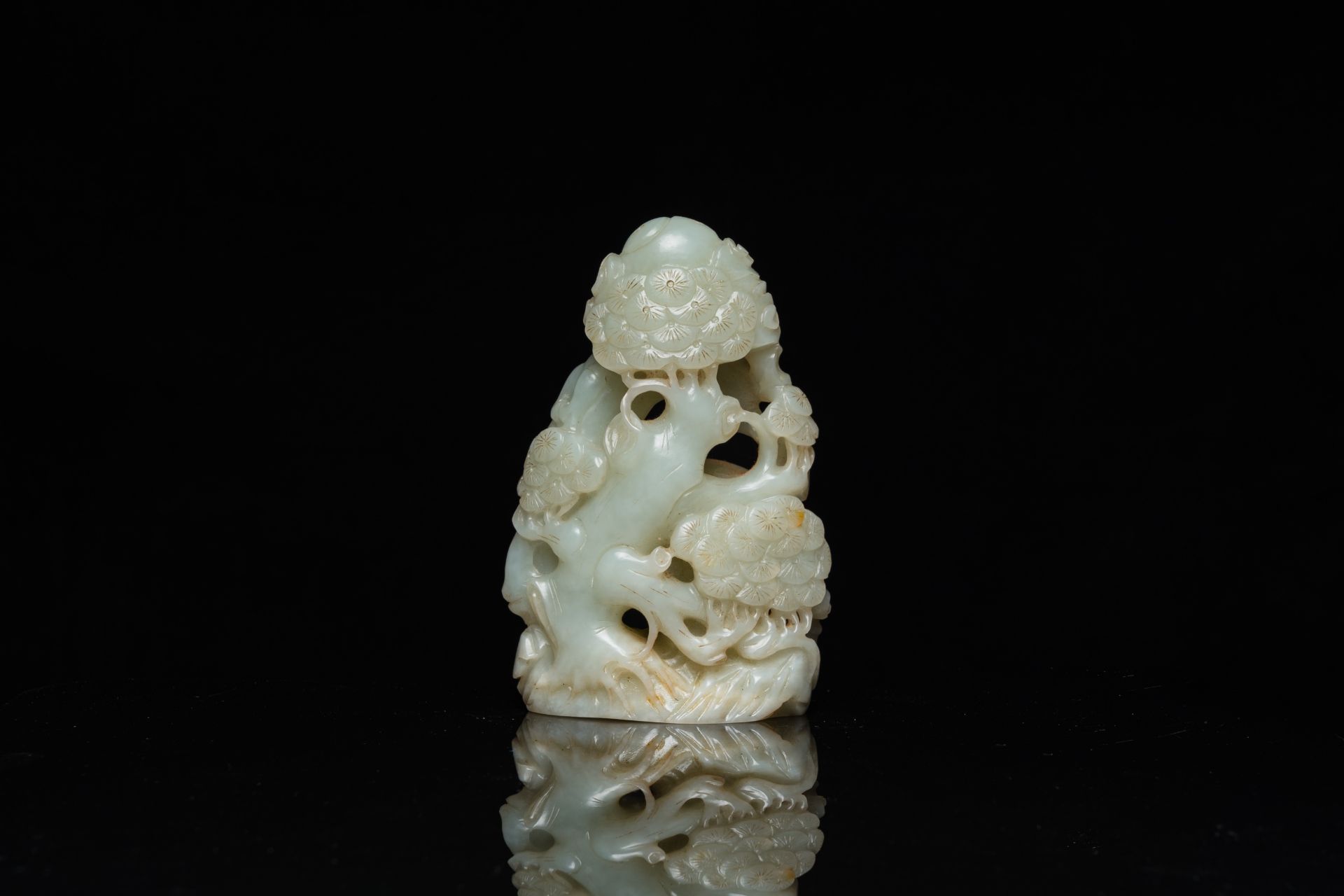A Chinese celadon and russet jade ram sculpture on wooden stand, 19th C. - Image 4 of 18